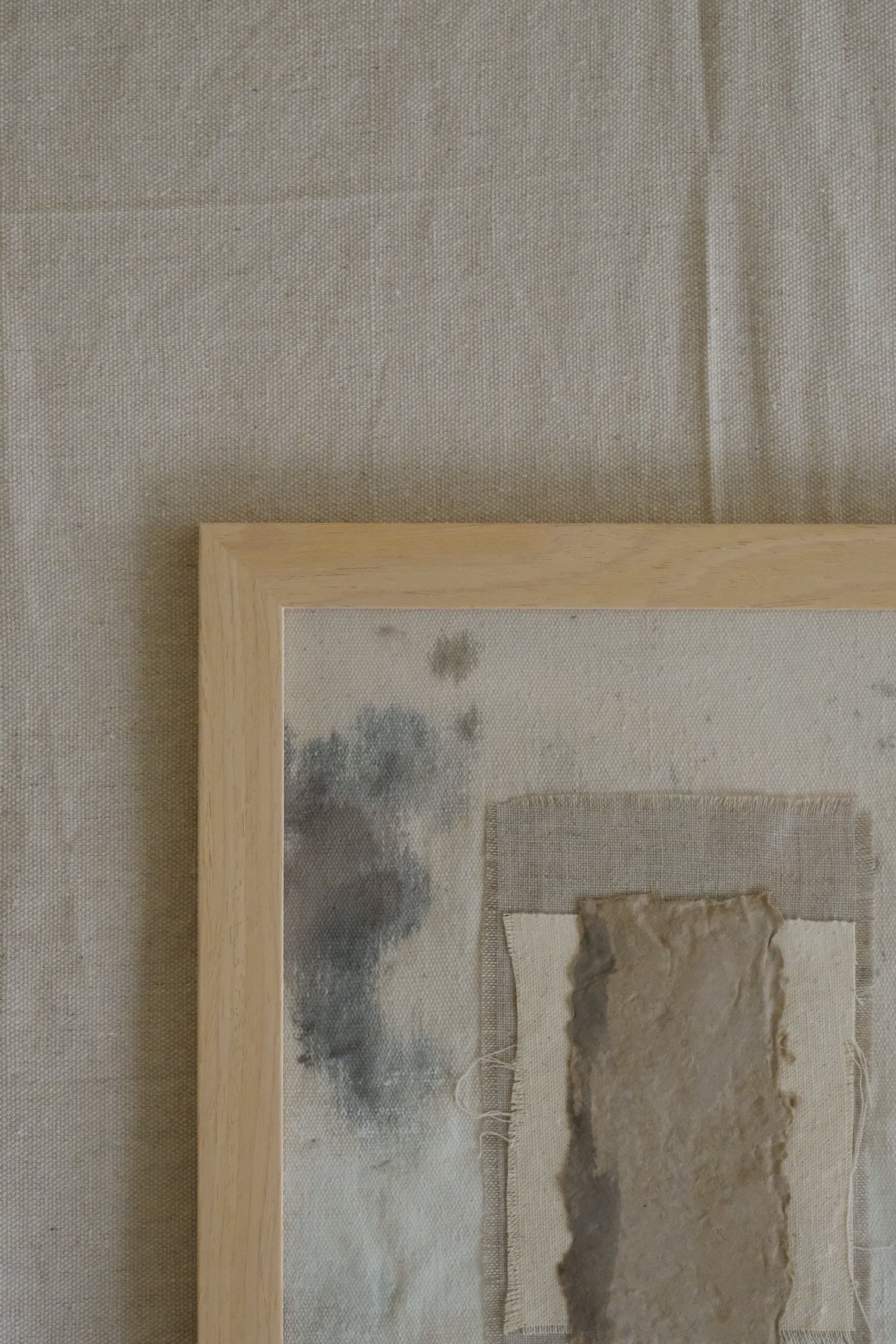 Framed 11 x 14 collage of textured brown paper layered over ivory canvas and grey linen