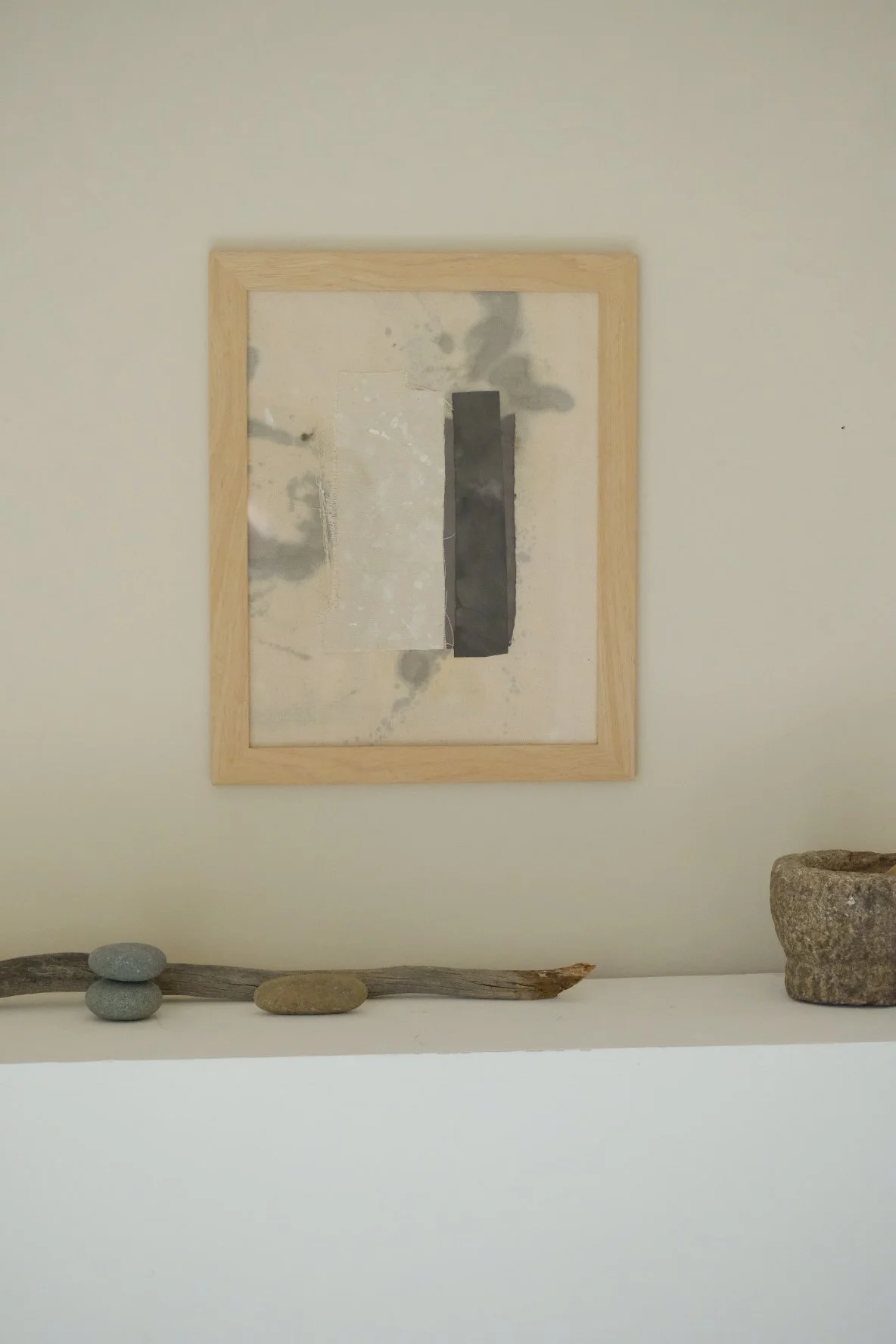 Framed 11 x 14 collage of a cream canvas strip beside a tall charcoal paper strip