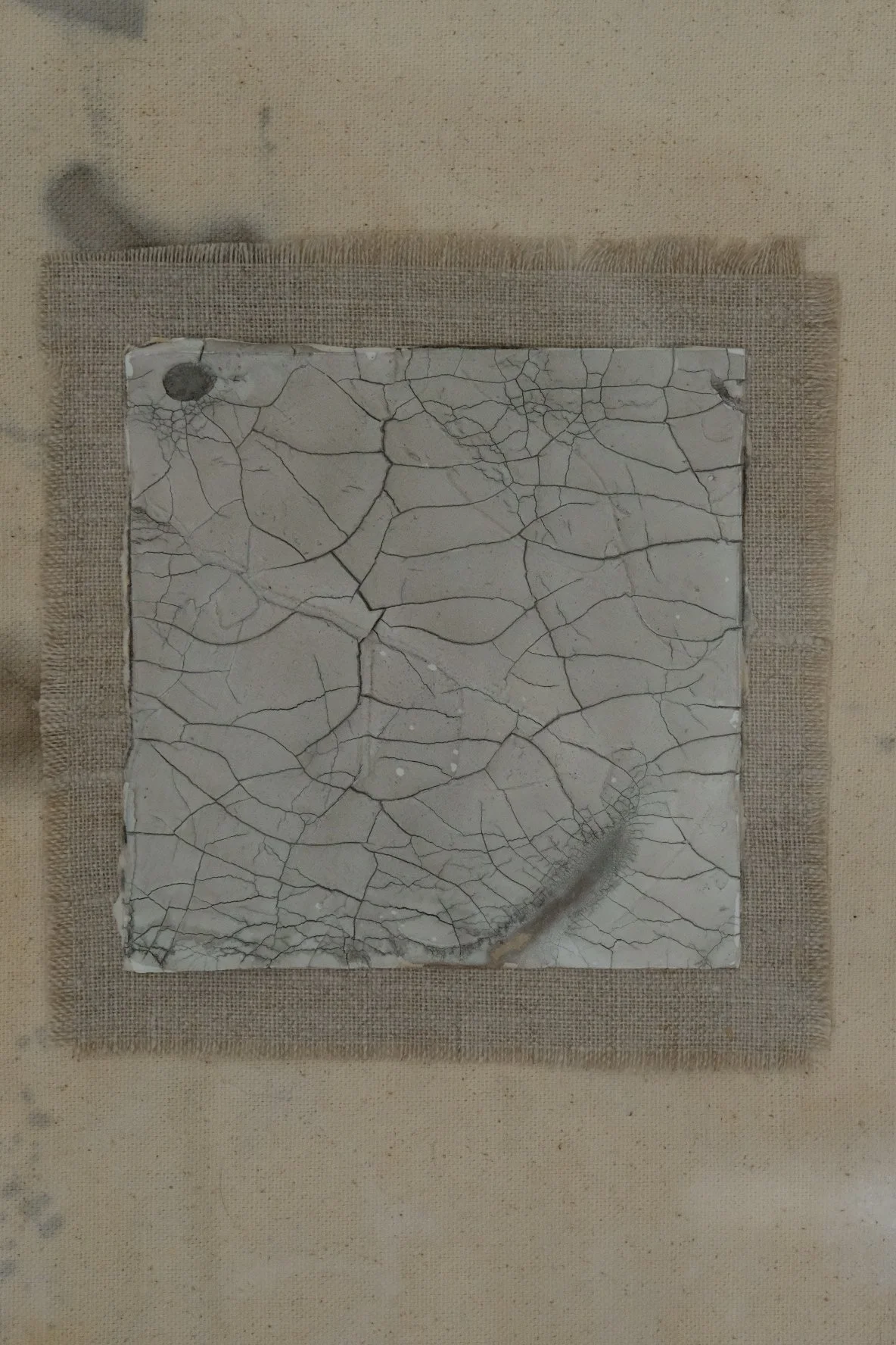 Framed 11 x 14 collage of a crackle paste square on a frayed grey linen patch