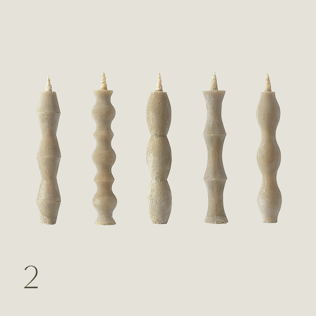 Set of Japanese haze wax taper candles in sculptural rippled, beaded and curved shapes