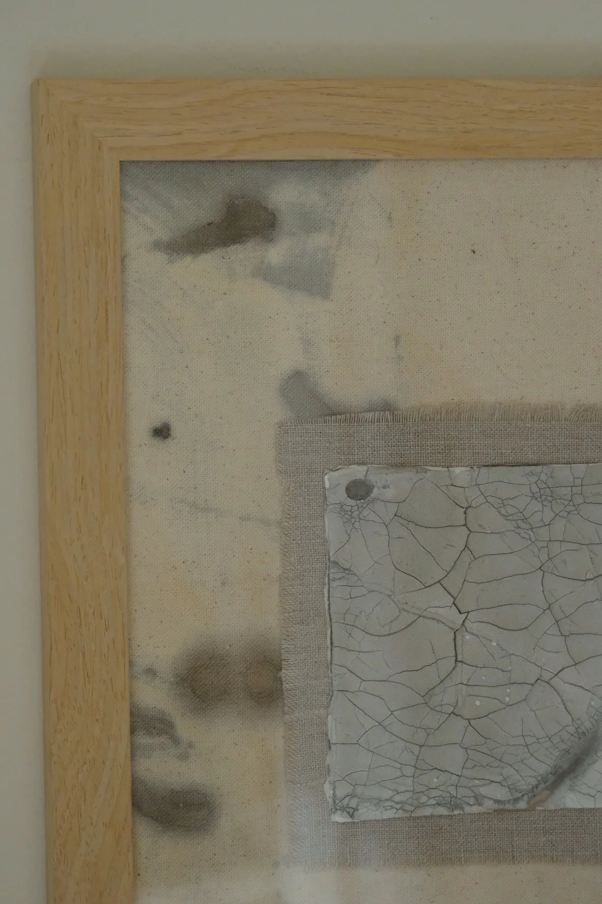 Framed 11 x 14 collage of a crackle paste square on a frayed grey linen patch