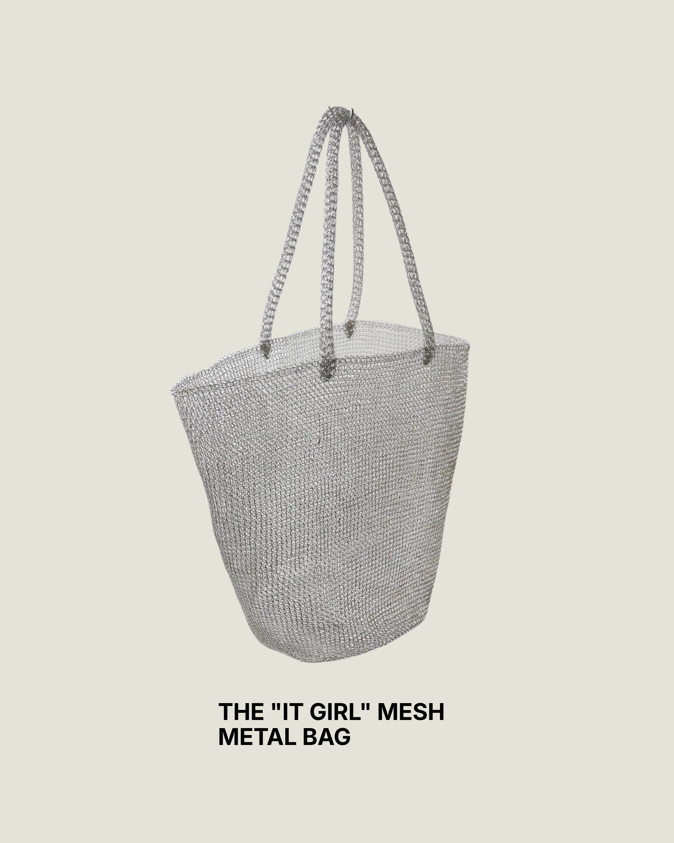 Woven silver metal mesh tote bag hanging from a black rail against a white wall