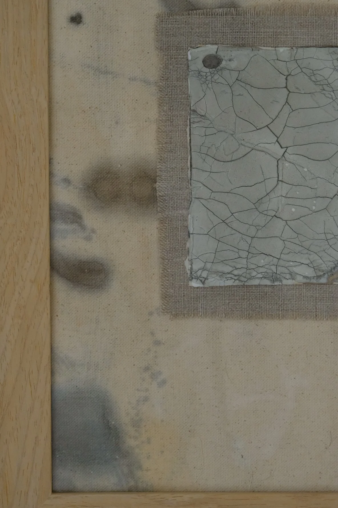 Framed 11 x 14 collage of a crackle paste square on a frayed grey linen patch