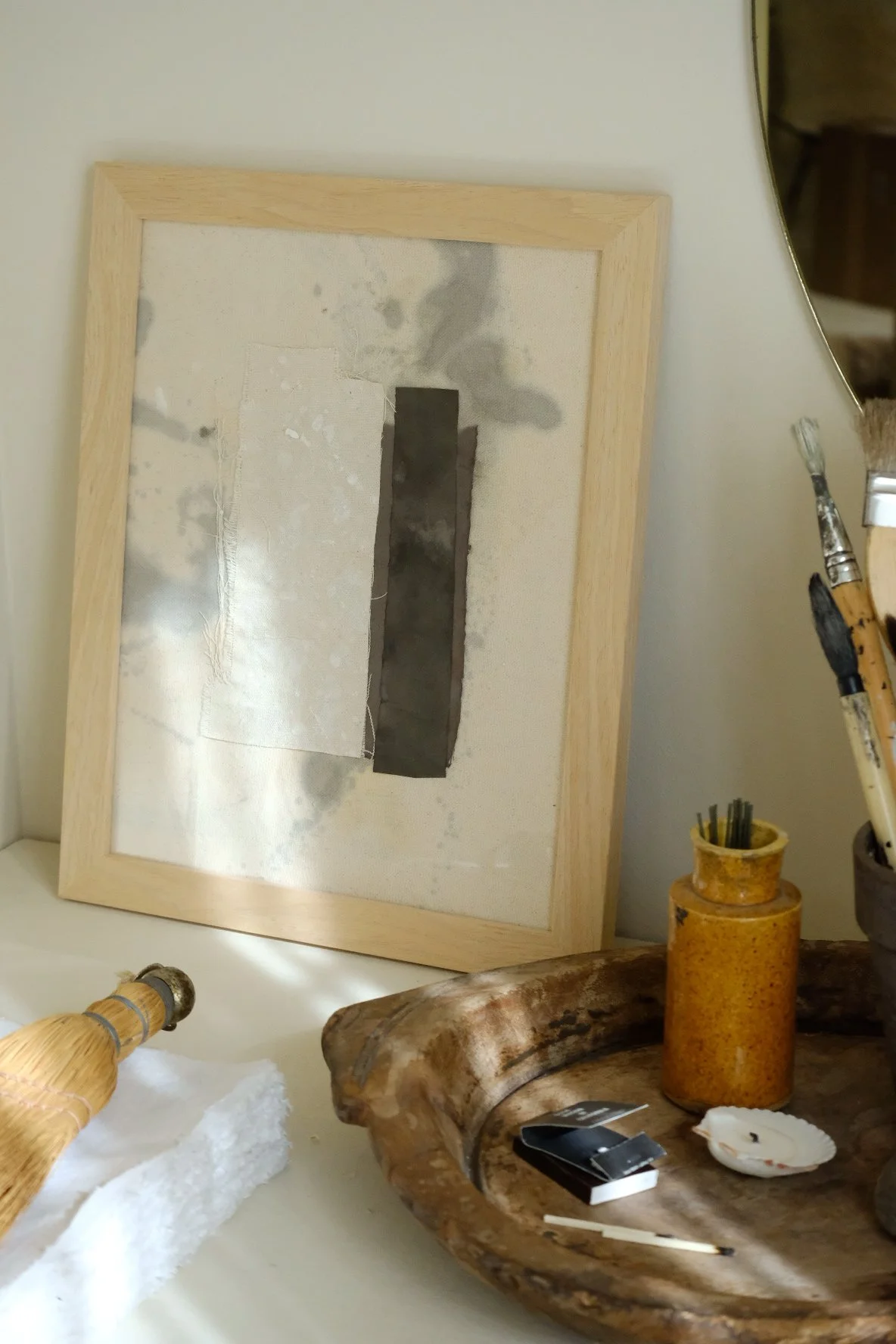 Framed 11 x 14 collage of a cream canvas strip beside a tall charcoal paper strip