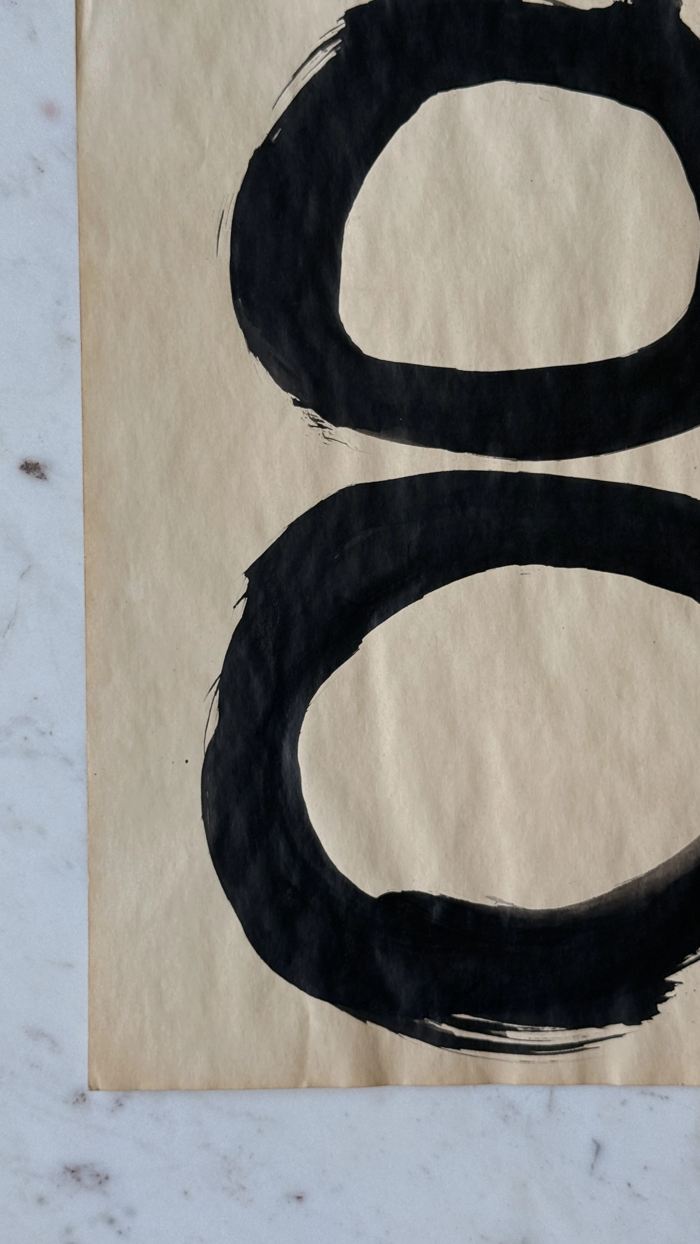 Original abstract ink artwork featuring hand-painted black circles stacked vertically on warm vintage paper.