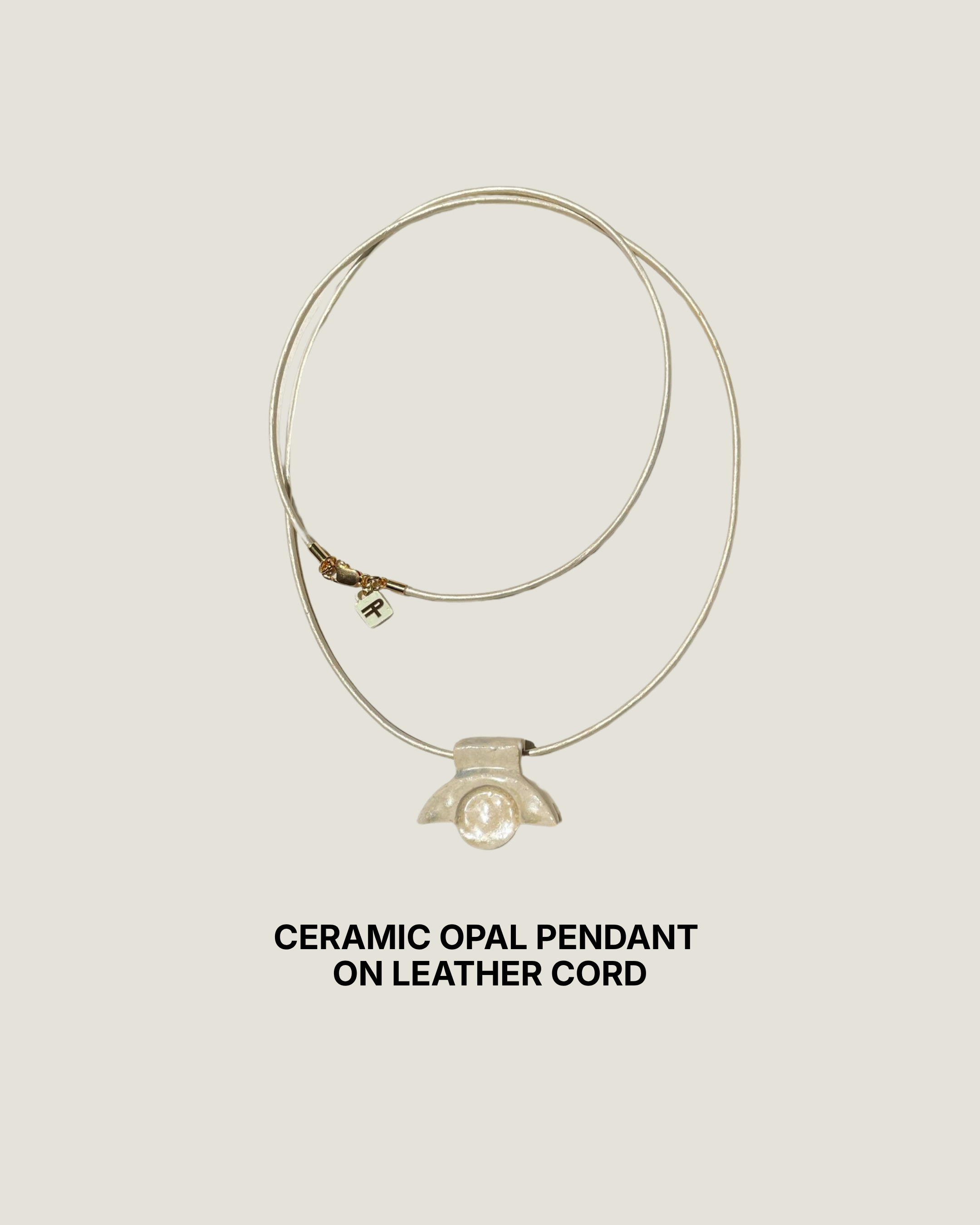 Ivory ceramic opal pendant necklace on an iridescent white leather cord