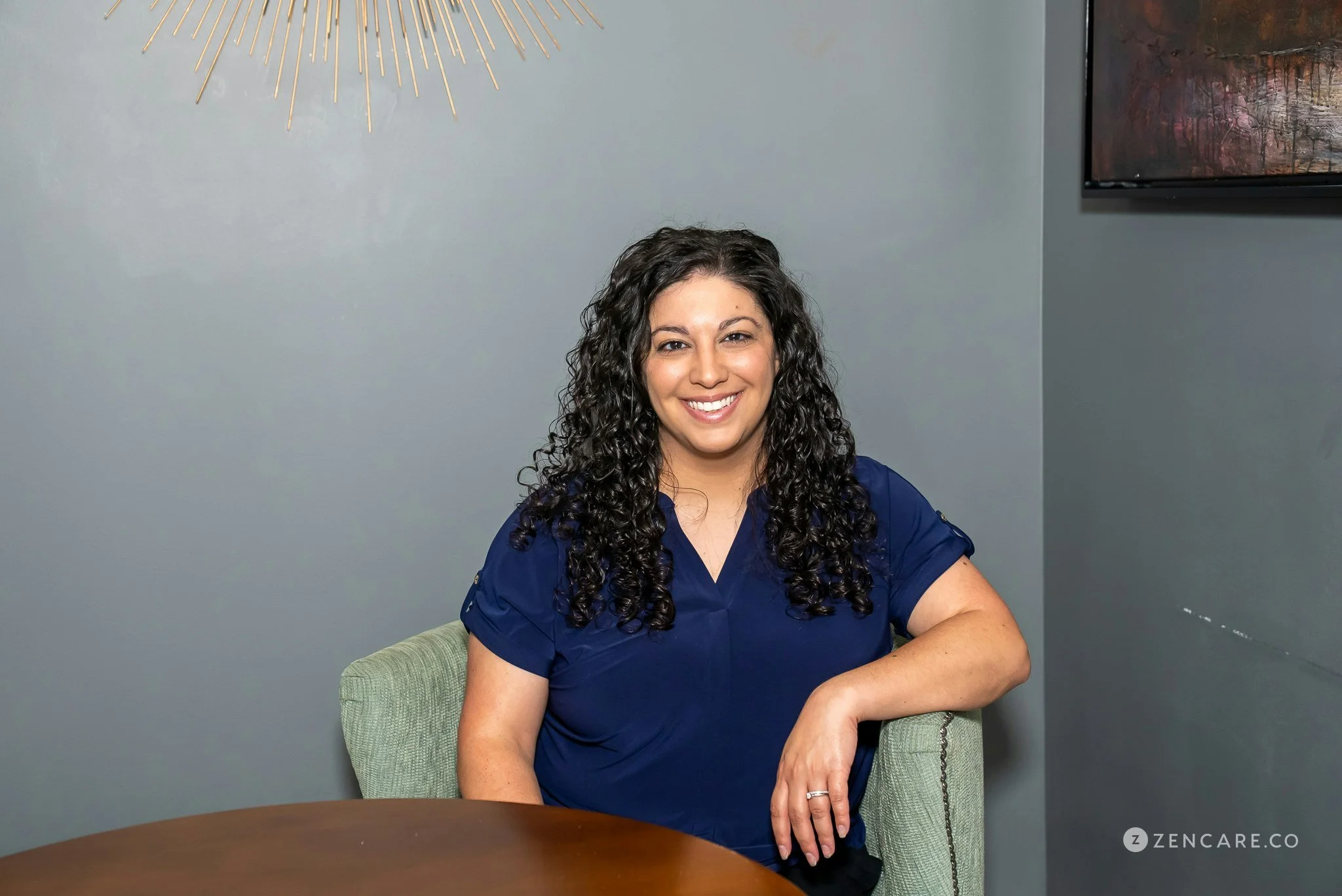 woman sitting in chair and smiling