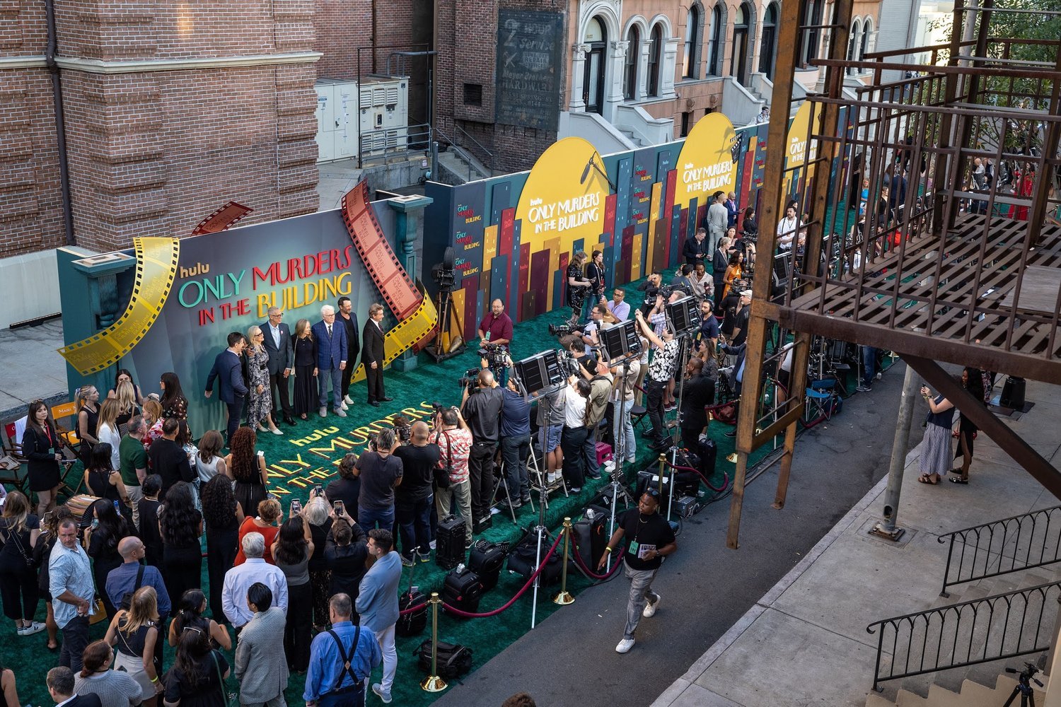 Event attendees and photographers at the "Only Murders in the Building" Hulu premiere.