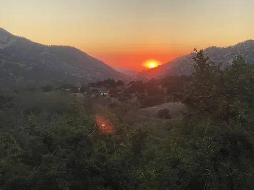 Evening views at Baxter Ranch overlooking rolling hills, forested valleys, and the colorful sunsets that make the Sierra Nevada foothills a memorable mountain retreat.