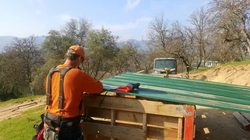 Baxter Ranch owner completing hands-on improvements to the chicken coop, reflecting the craftsmanship, care, and connection behind this working mountain ranch.