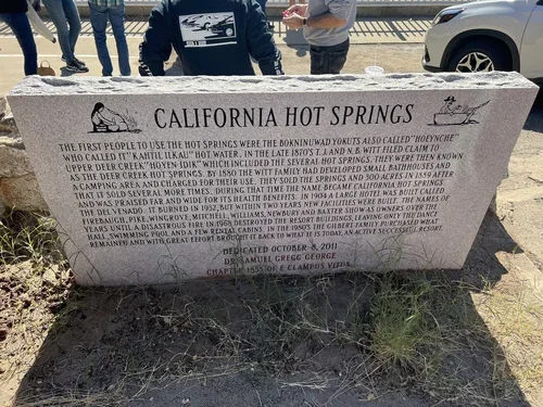 California Hot Springs sign near Baxter Ranch, showcasing the mountain community and natural hot spring destination surrounded by the Sierra Nevada landscape.
