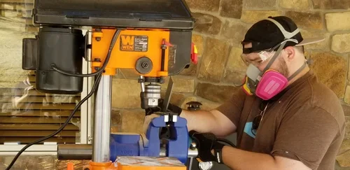 A Baxter Ranch family member crafting and building in the workshop, reflecting the skill, dedication, and hands-on work that helped shape the mountain retreat.