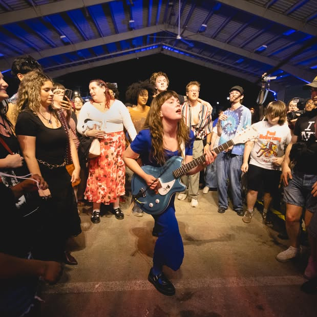 Lead singer of Girl Tones in the Mayhem crowd during the band's headlining performance. 