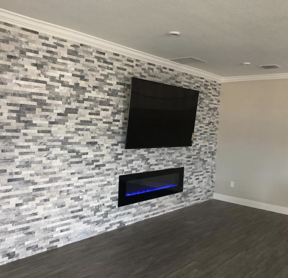 Oranssi technician working on a roof project