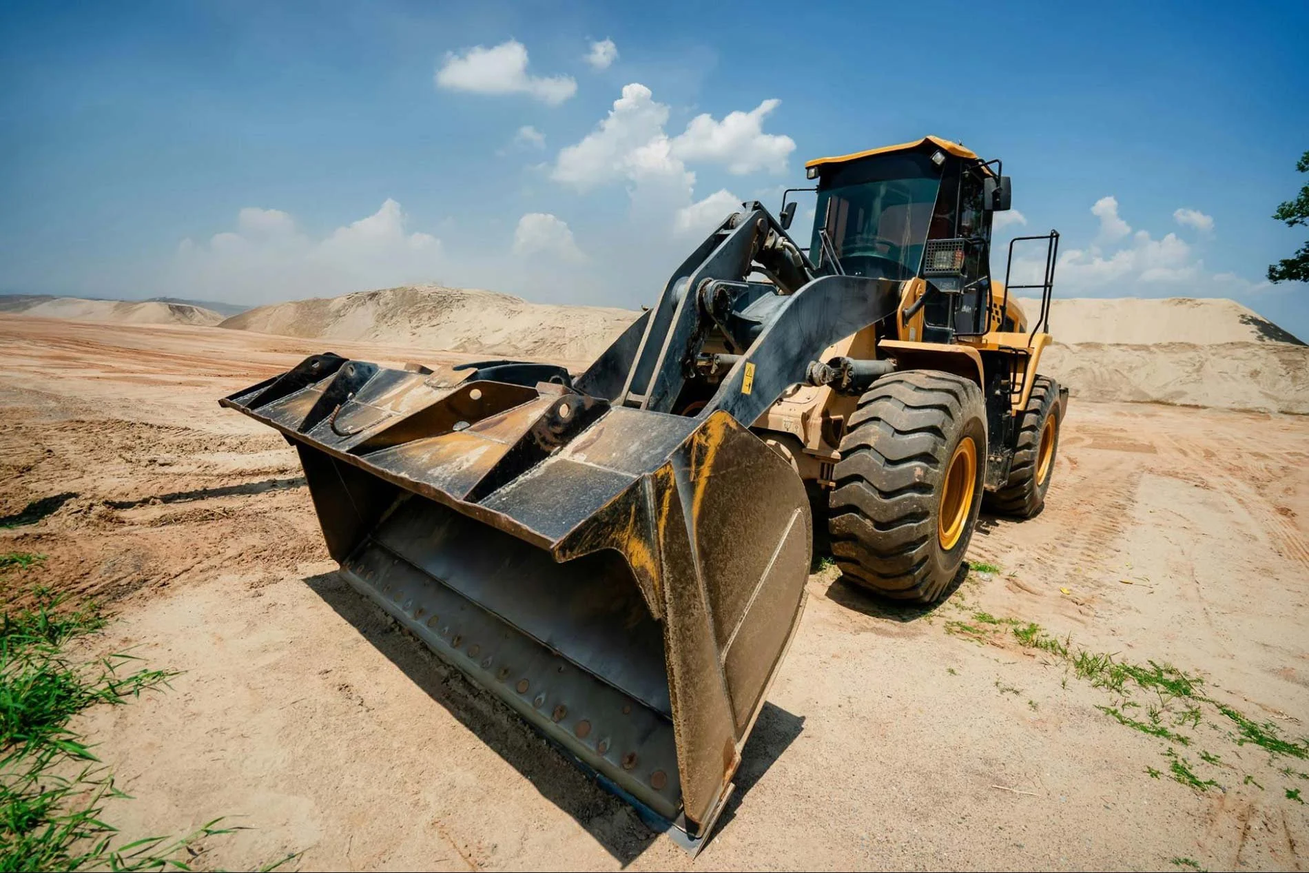 Heavy equipment performing land clearing in Prosper, TX, on sandy terrain