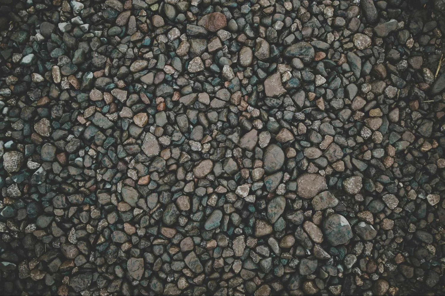 Close-up of mixed gravel stones used for professional driveway installation