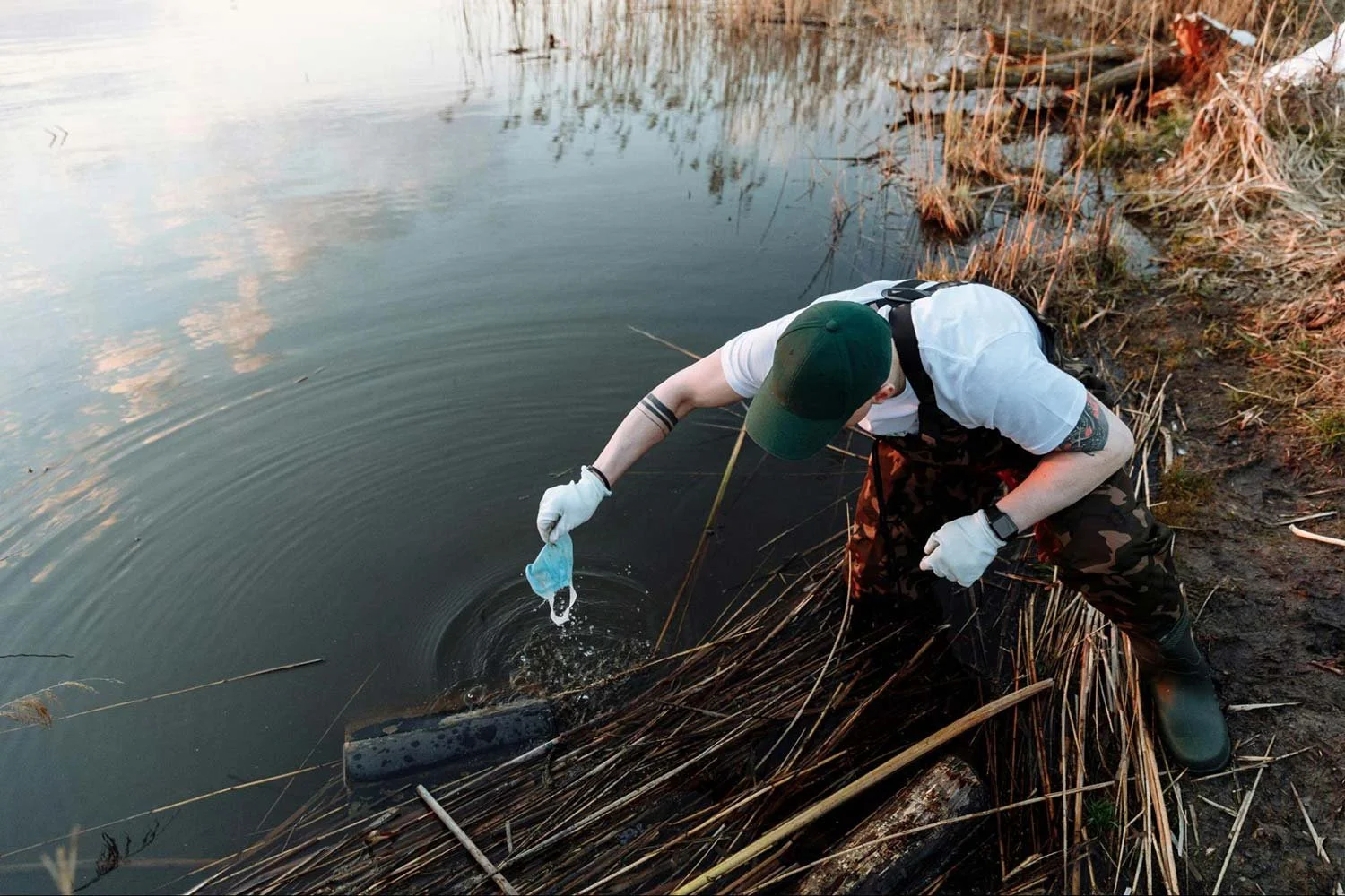Removing debris from a pond shoreline