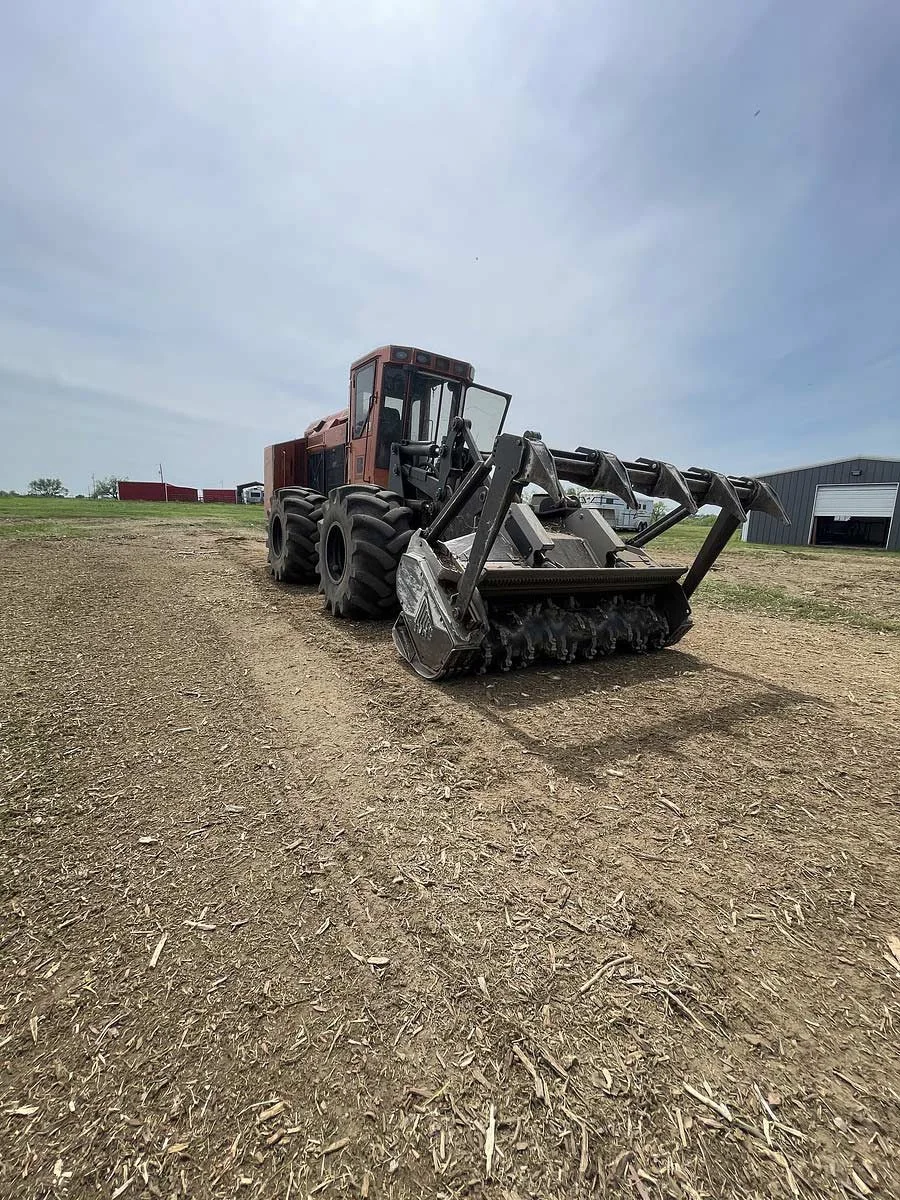 Land clearing machinery after removing debris and vegetation from rural acreage