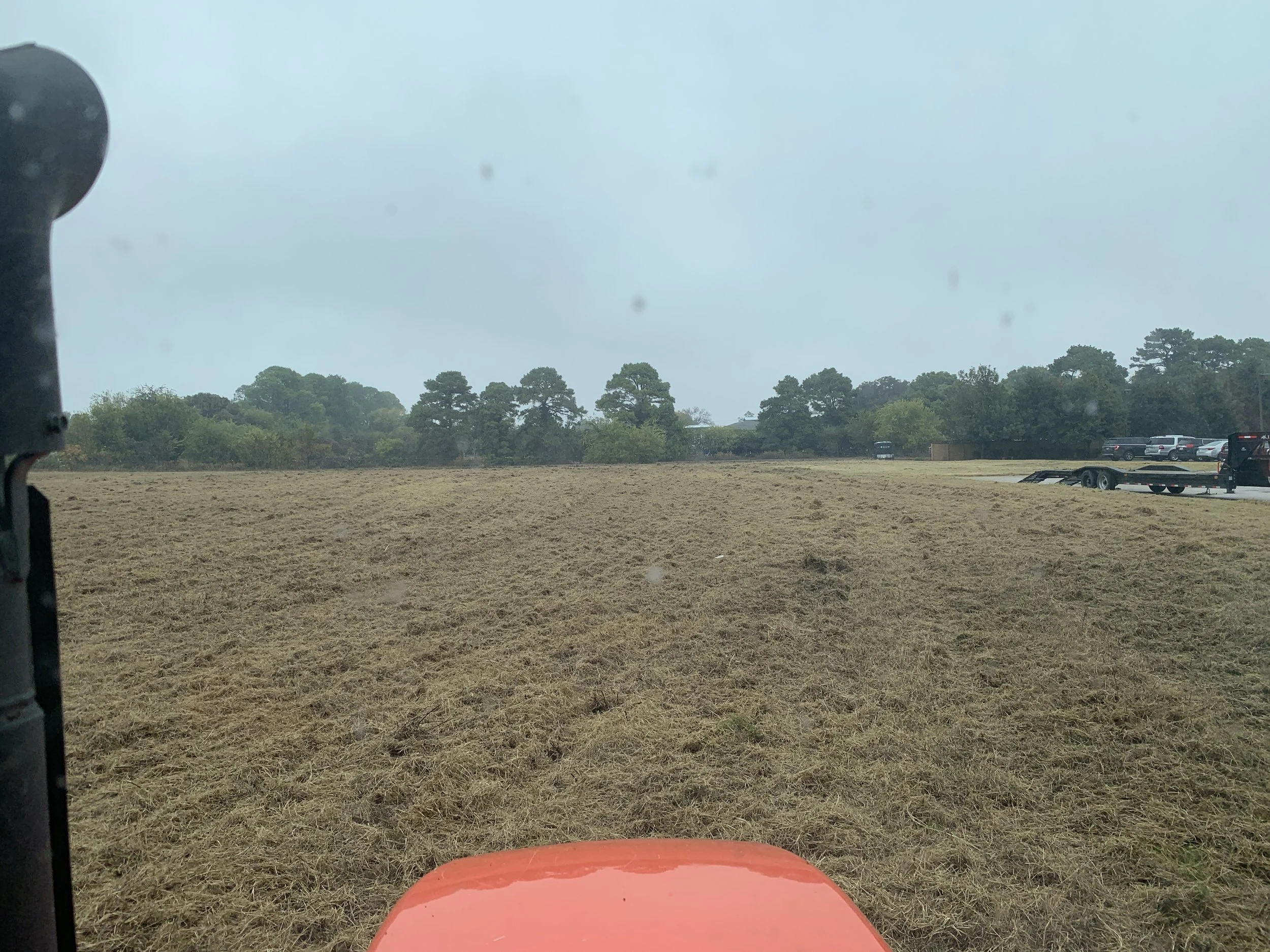 Tractor mowing through a field