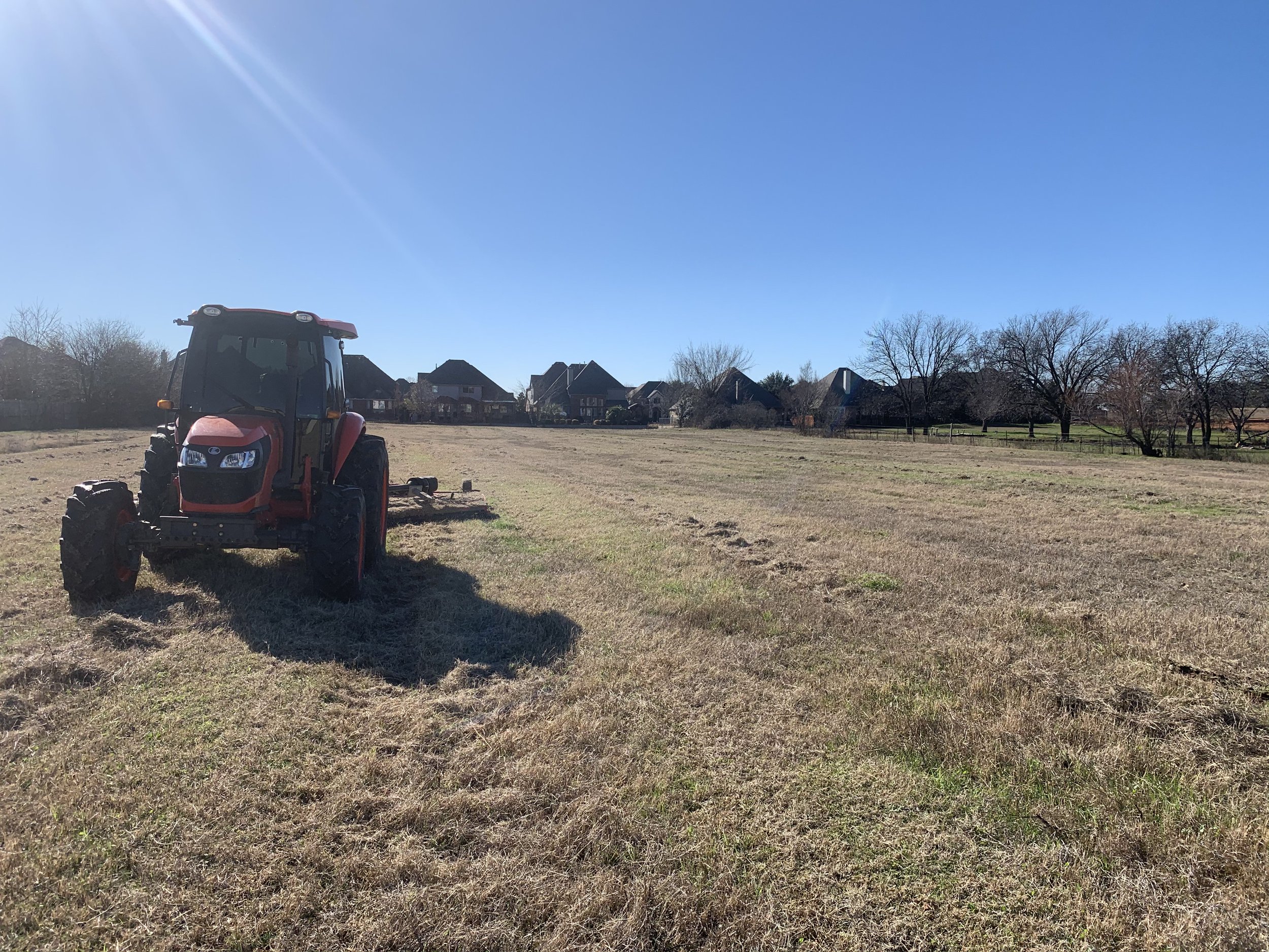 Tractor moving around a field 