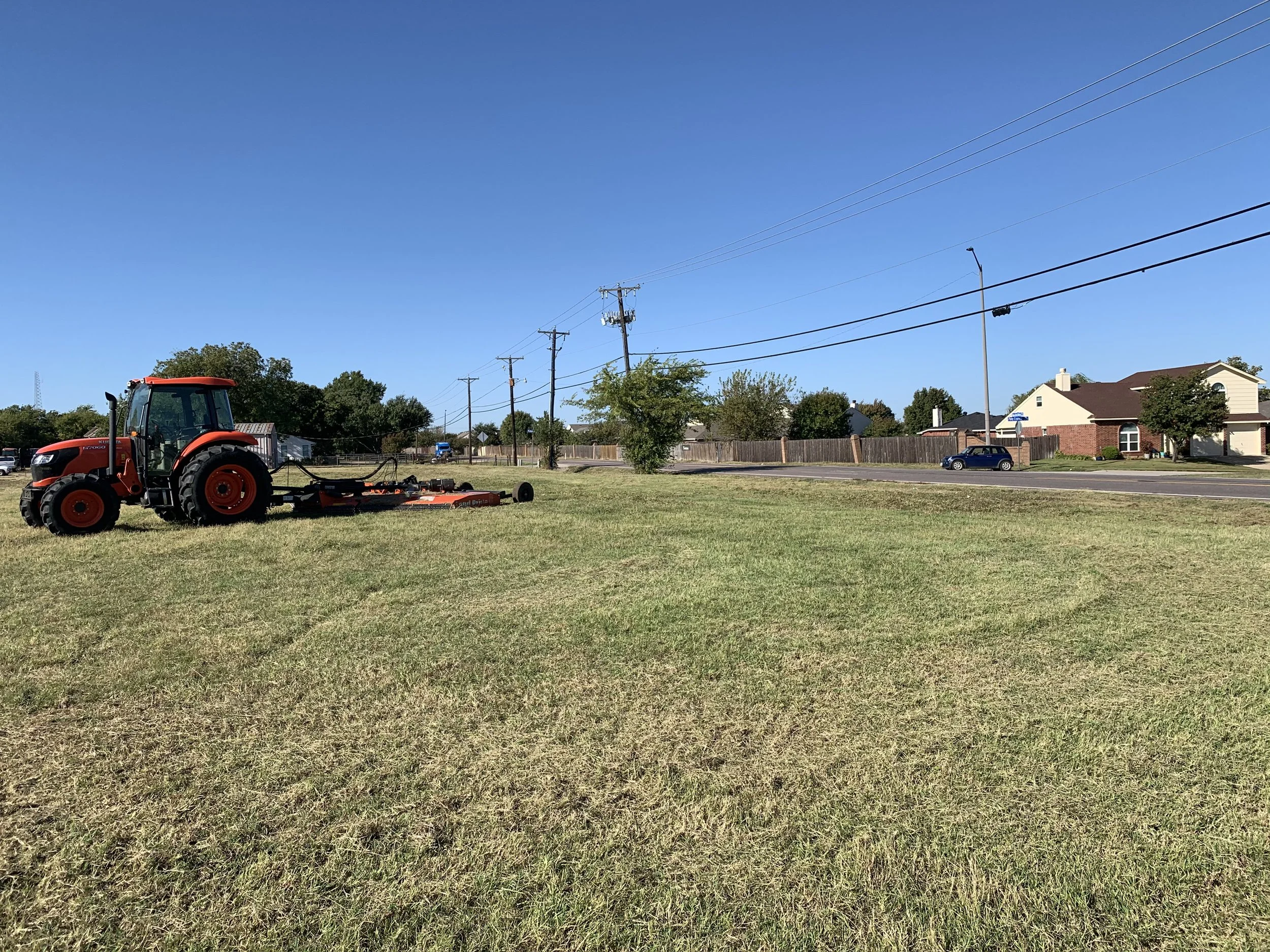 Tractor mowing on a field