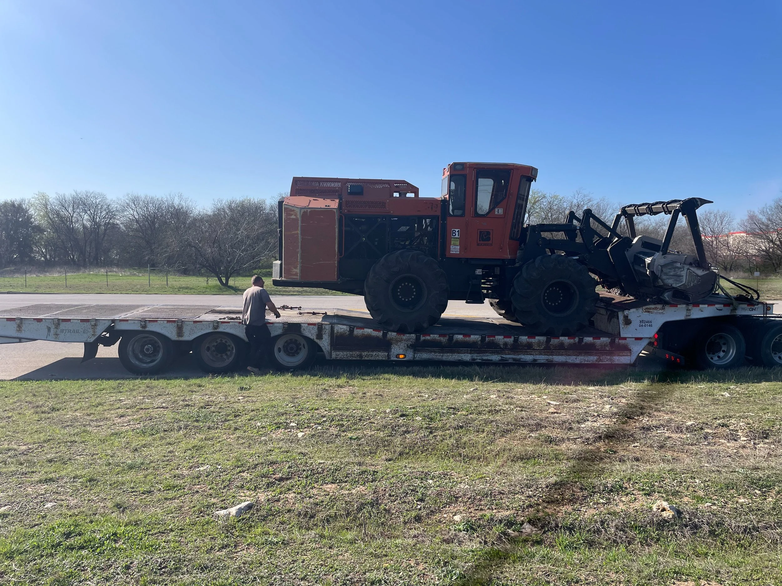 Professional Grade Forestry Mulching Machine unloading for Breckenridge, TX Land Clearing.