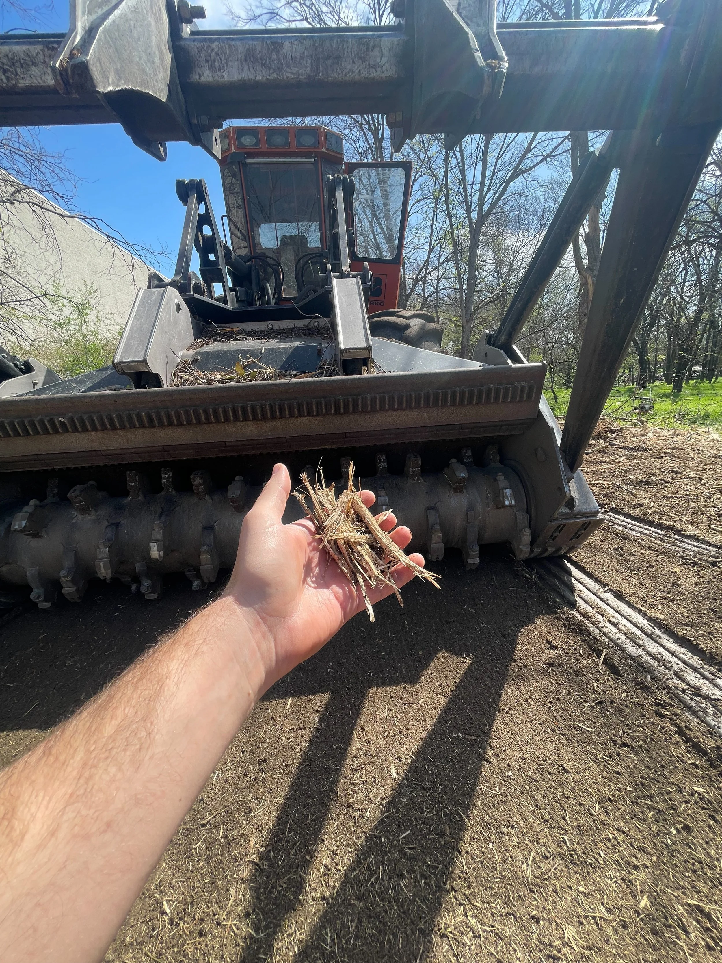 Heavy Equipment Forestry Mulcher with mulch results.