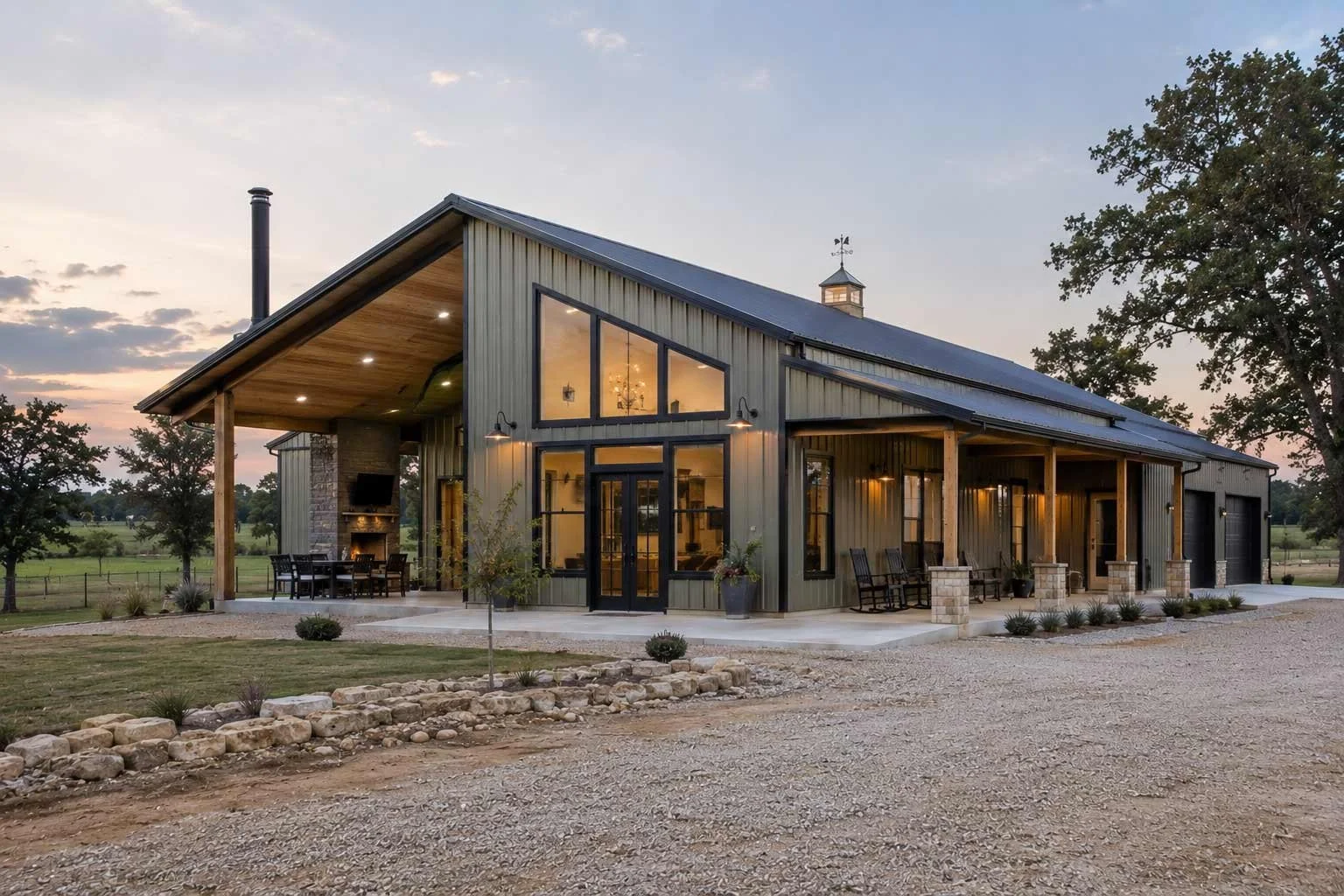 A new barndominium with angled windows and a built-in patio