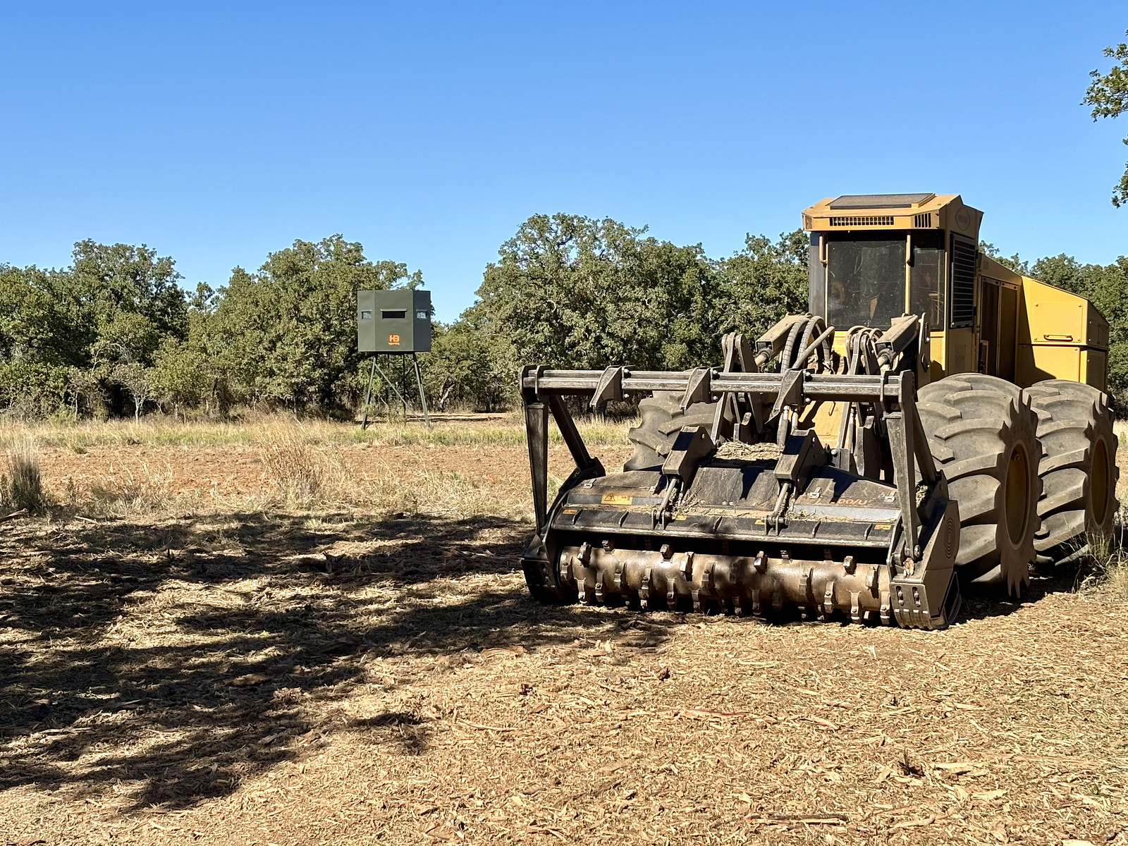 A 5k mulcher parked on recently mulched hunting acreage