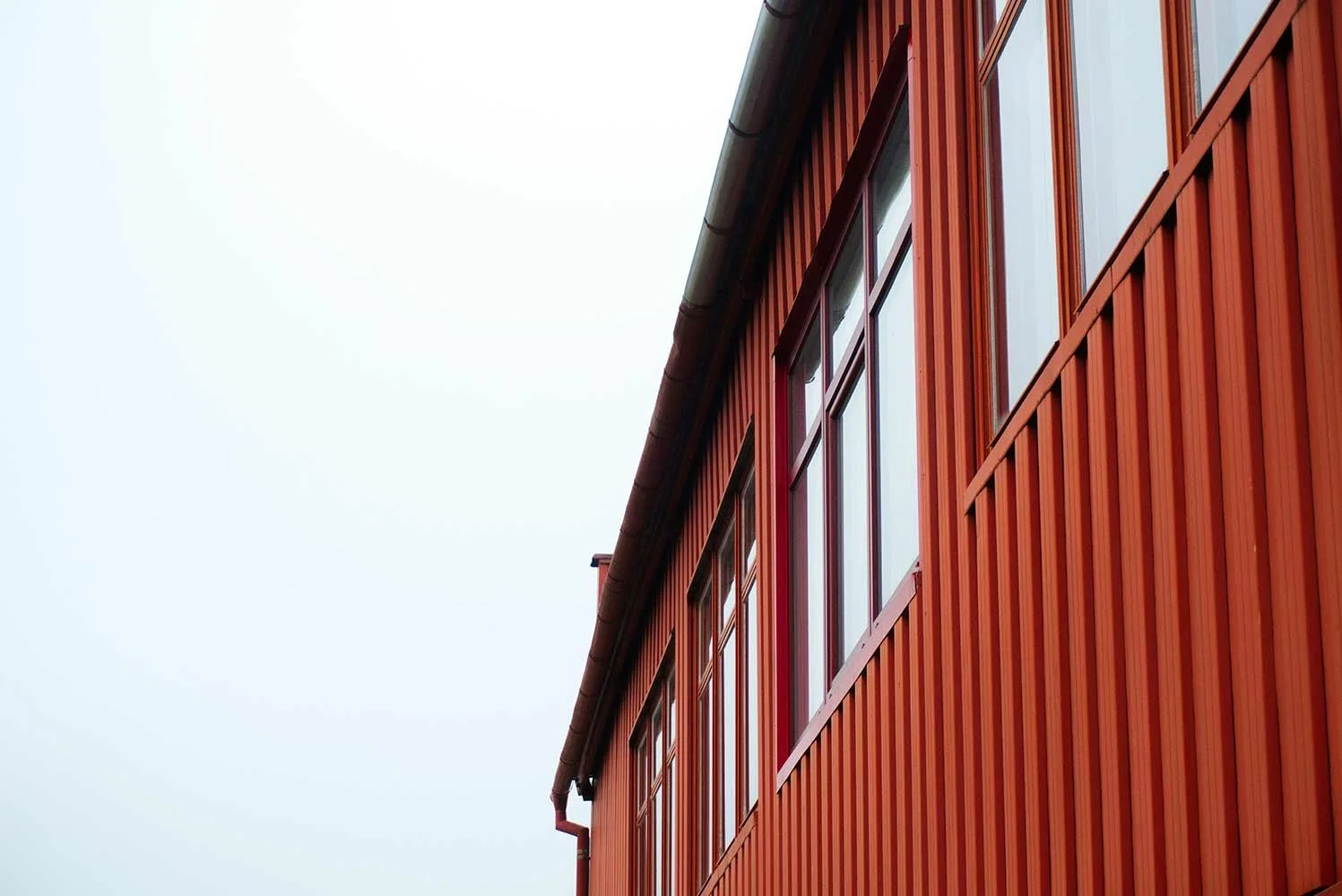 Windows on a red metal building