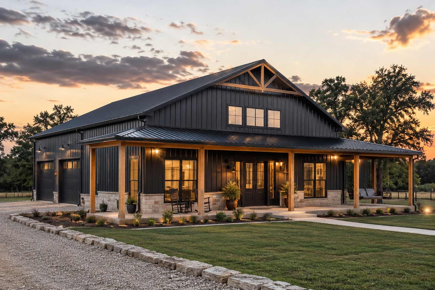 An elegant gray barndominium at twilight