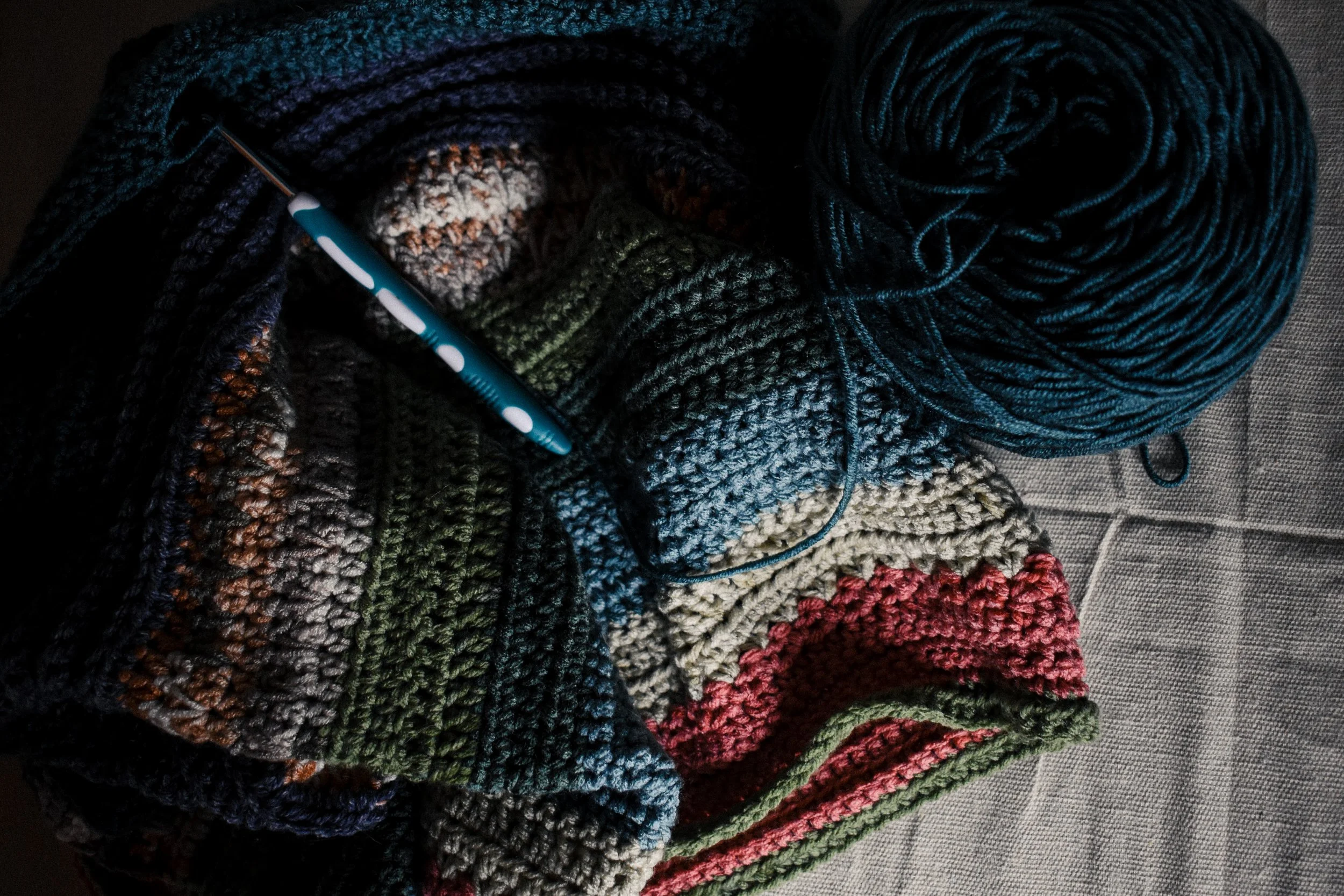 crochet blanket being worked on with crochet hook