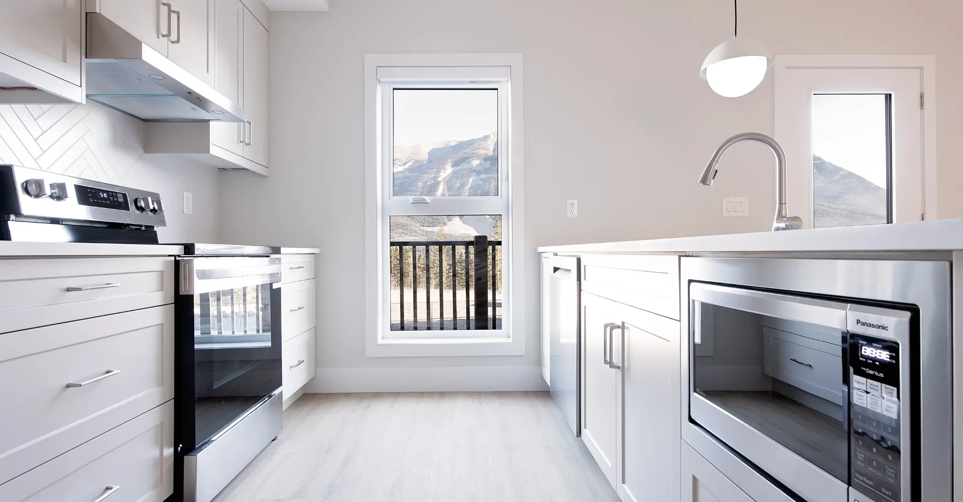 Canmore-Ashton-Construction-Services-ACS-Project-Canmore-Community-Housing-Ptarmigan-Pointe-kitchen-appliances.png.webp
