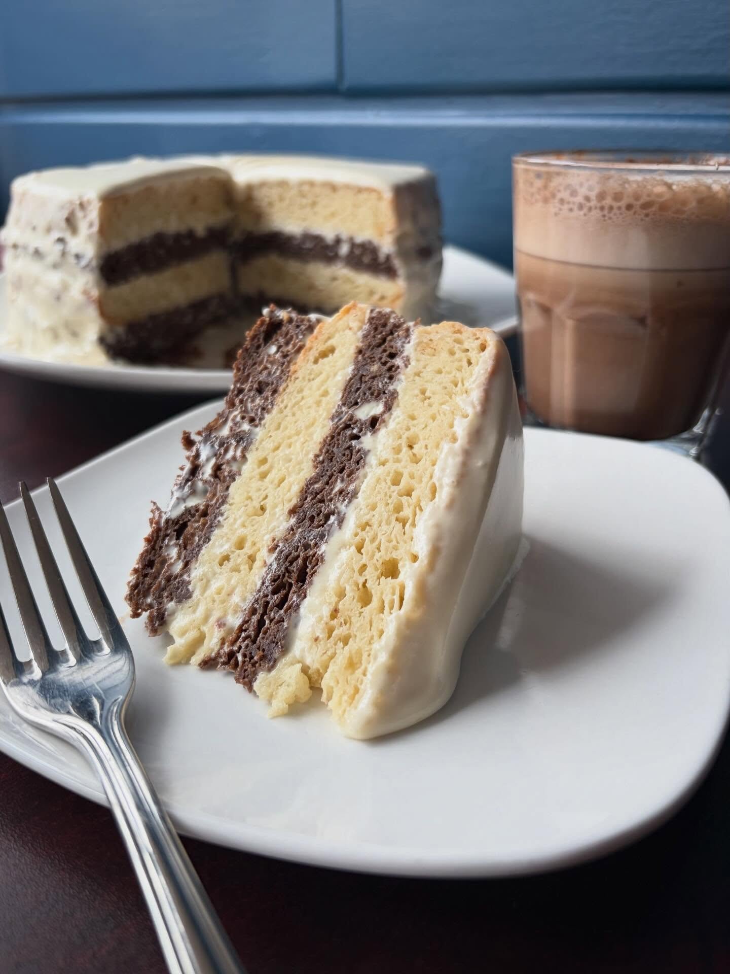 Dairyland is serving ✨LAYERS✨&hellip;
.
Come grab a slice of Katia&rsquo;s Special, Day and Night Cake! A Ukrainian specialty with layers of soft Vanilla and Chocolate Cakes with White Chocolate Ganache. Deliciously paired with a mocha and a puzzle. 