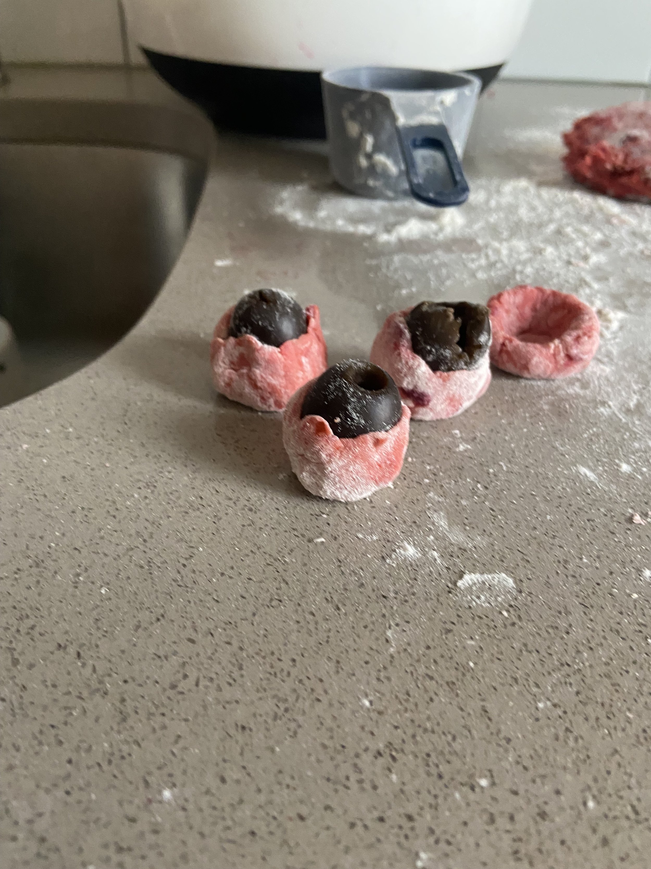 Knichi Creation: Homemade Beet Gnocchi wrapped around a black olive