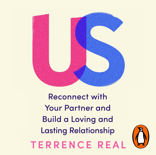 Book cover with large pink and blue letters 'U' and 'S', and title text 'Reconnect with Your Partner and Build a Loving and Lasting Relationship' by Terrence Real, with Penguin logo at the bottom right corner.