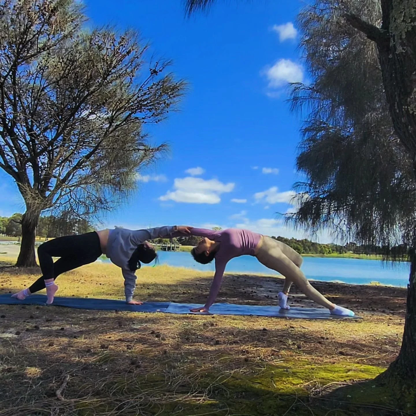 It's a perfect day for outdoor yoga with friends. I had such a good time with @teresawong_1123 🧡. The sunshine and lake were too good to be missed😆. 
ps. It would be better if we had a third person to take the photos instead of taking screenshots