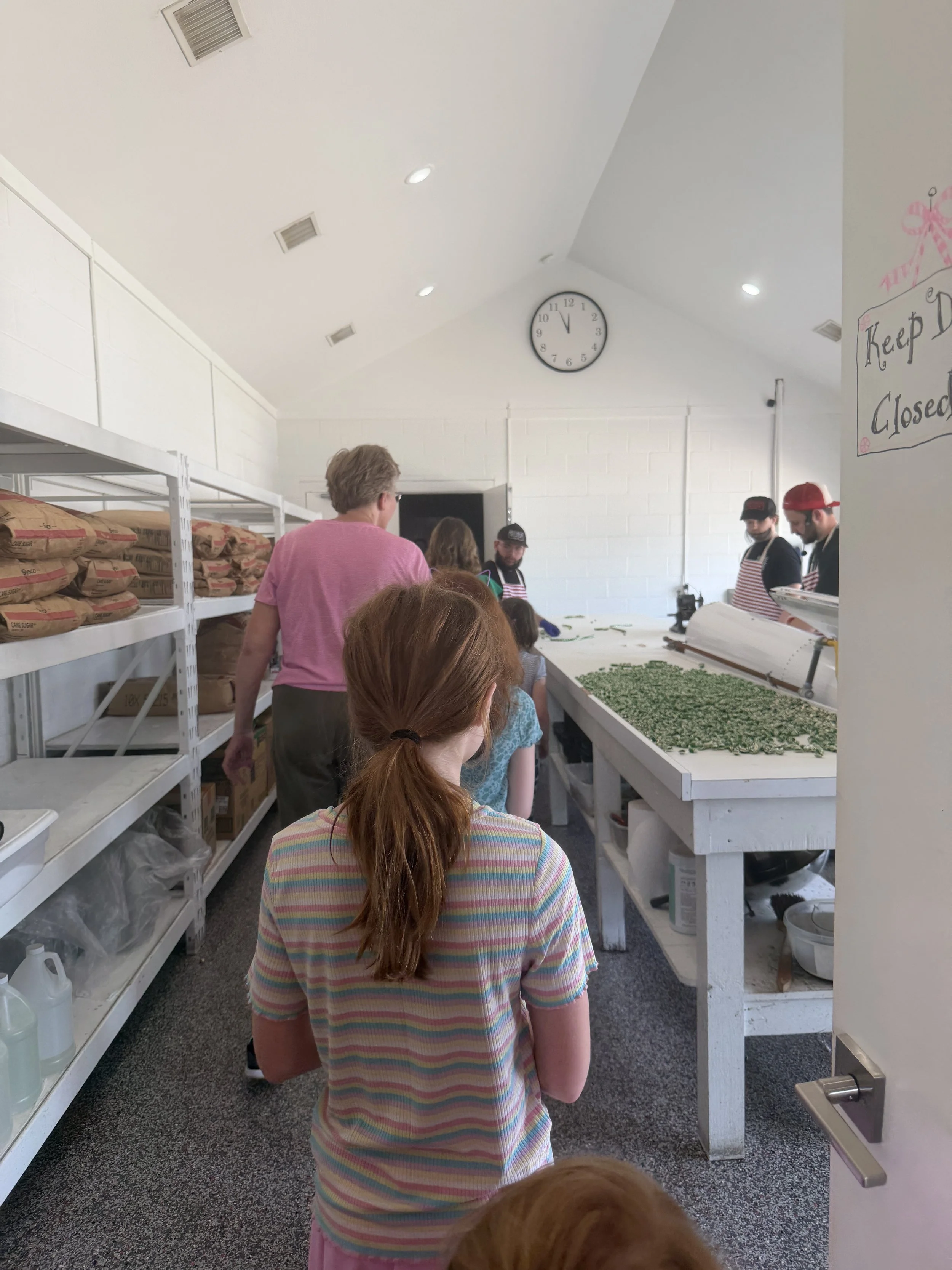 walking through the candy making room at lindale candy co.JPG