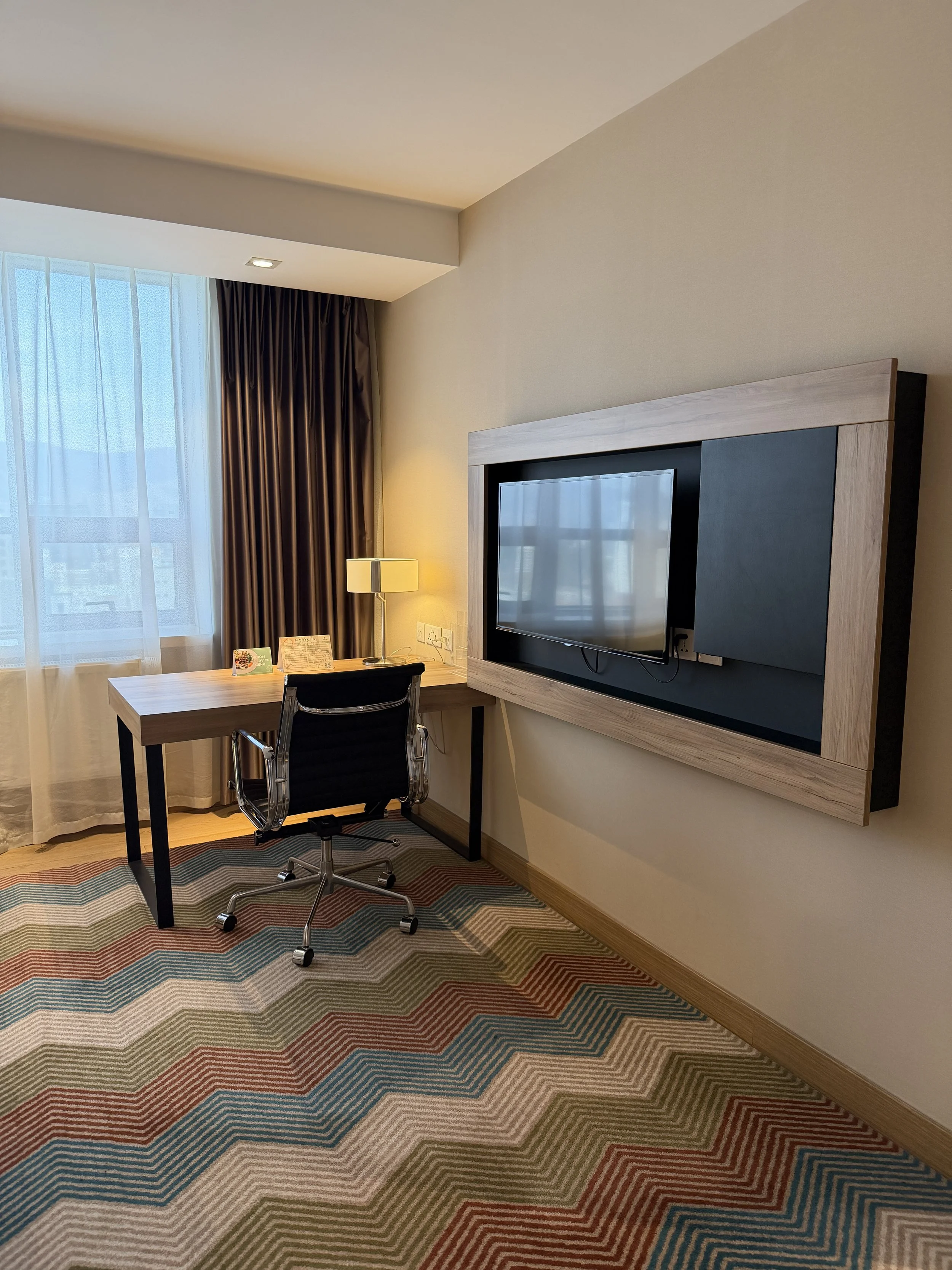 holiday inn ulaanbaatar IHG hotel 1 king bed suite tv desk.JPG