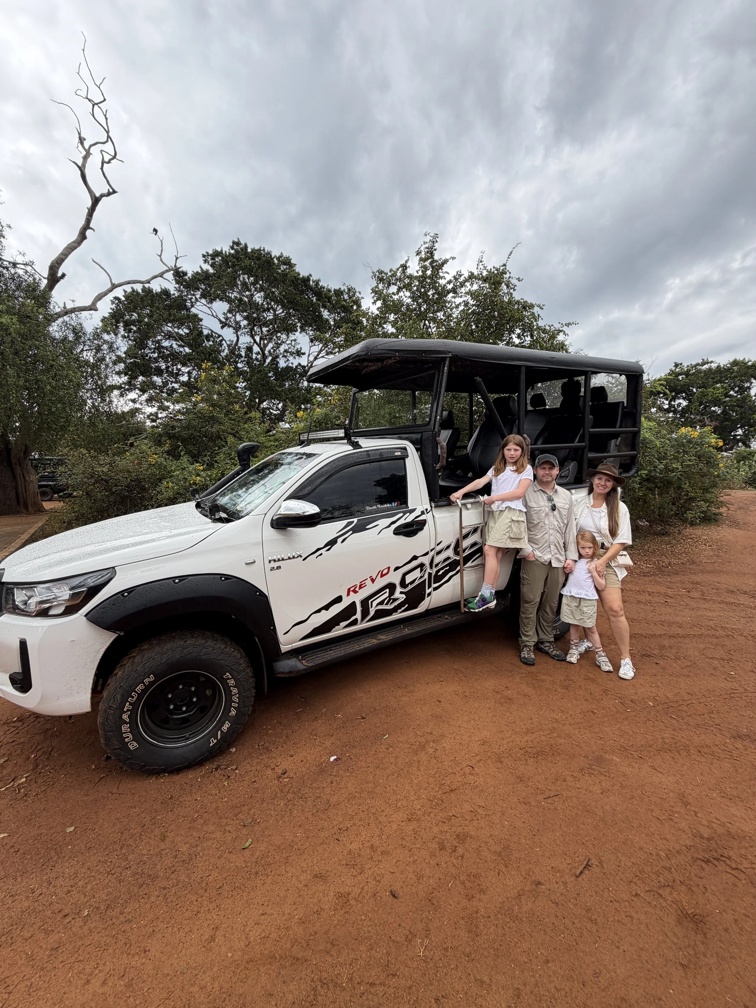 Family riding in a safari jeep inside Yala National Park in Sri Lanka