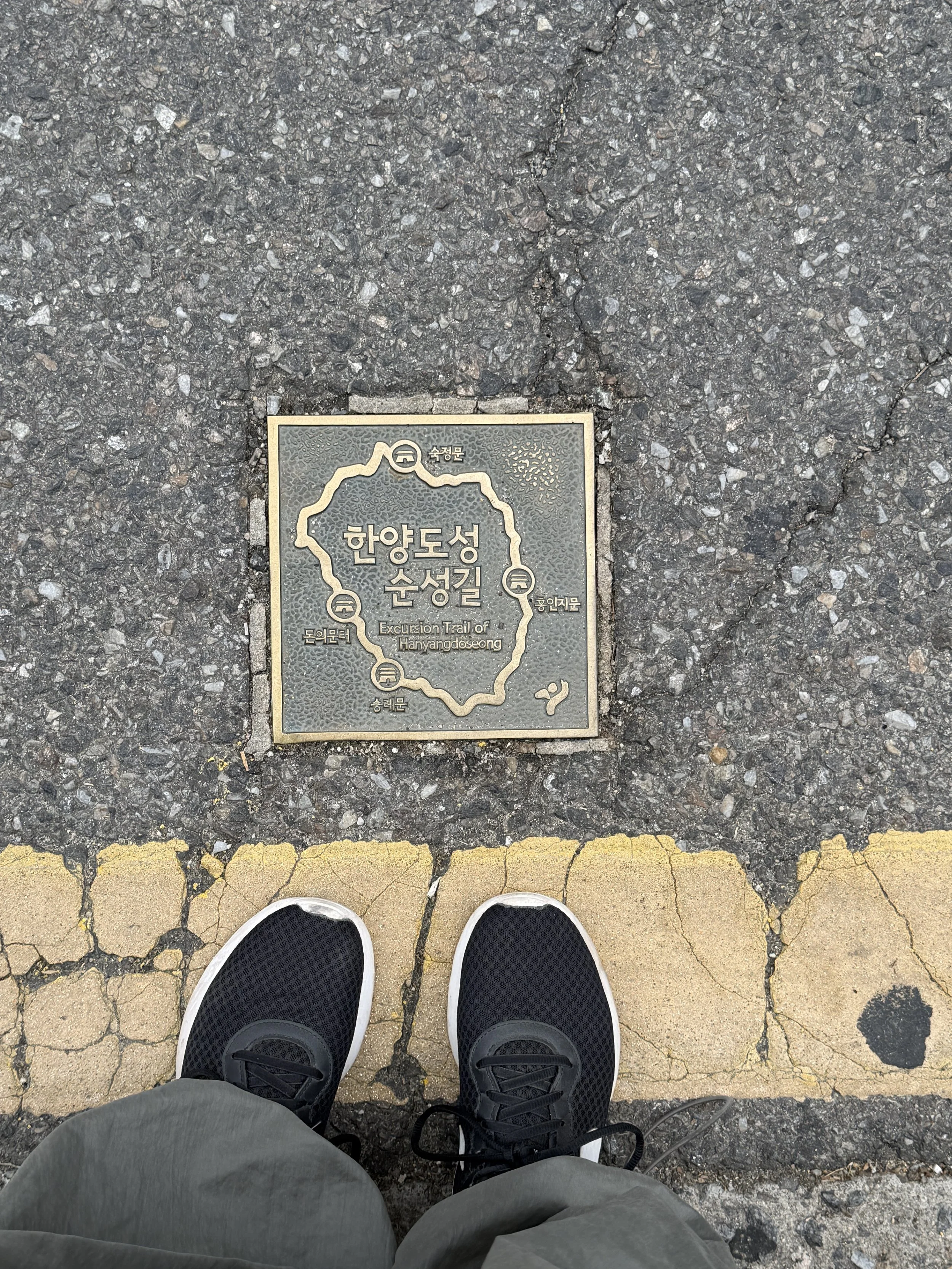 plaques to follow on the ground for hanyangdoseong seoul city wall.JPG