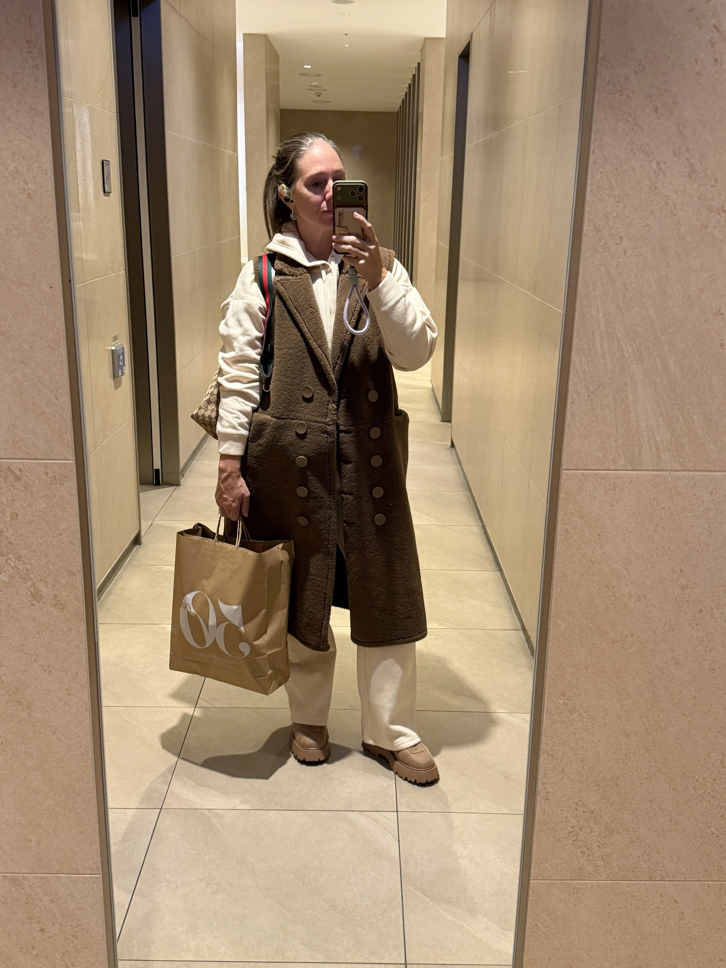 Cozy and casual in an elevated sweatsuit and zip front boots.