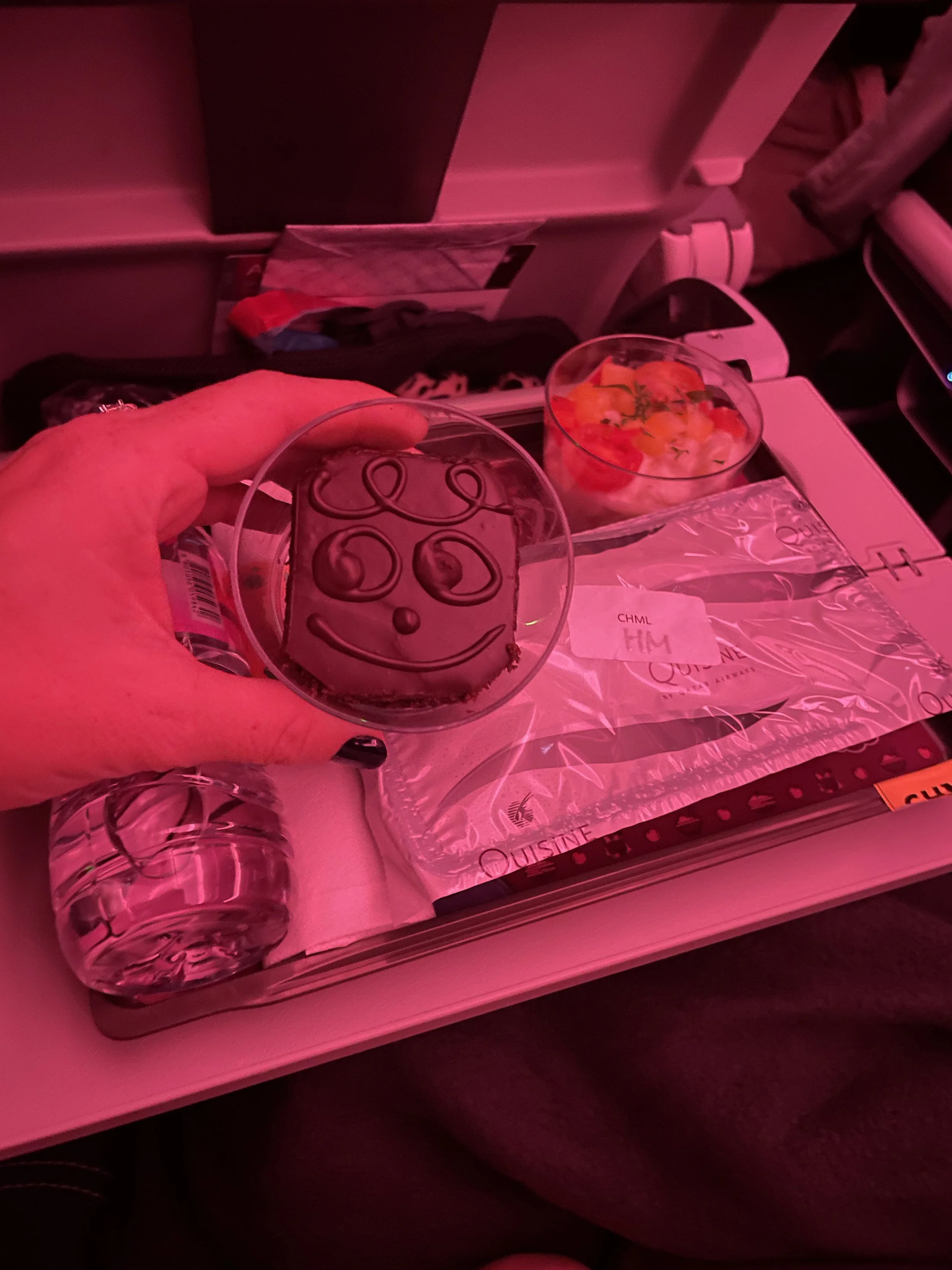 childrens meal on qatar airways economy class smiley face brownie.JPG