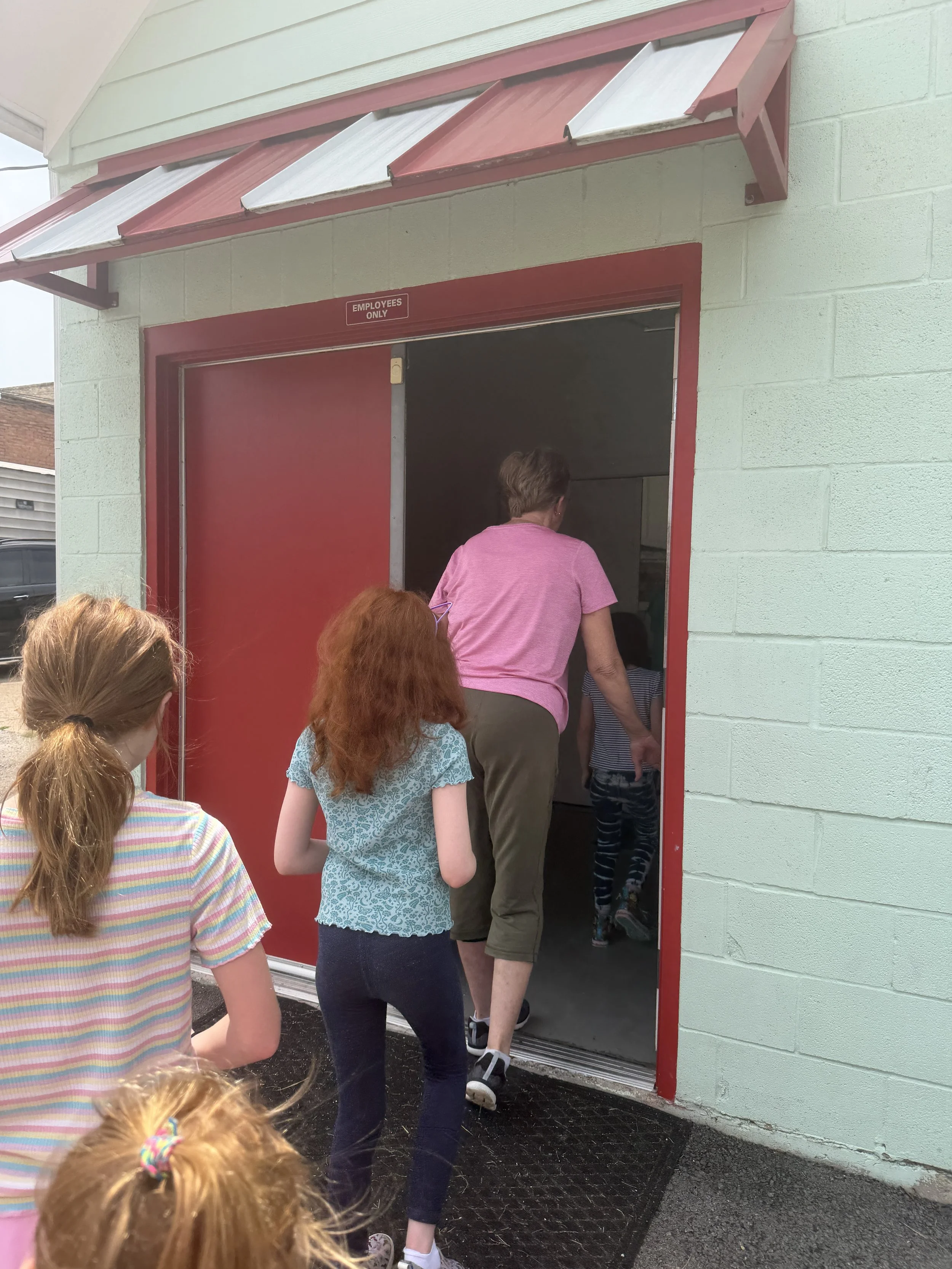 walking through the back entrance at lindale candy co.JPG