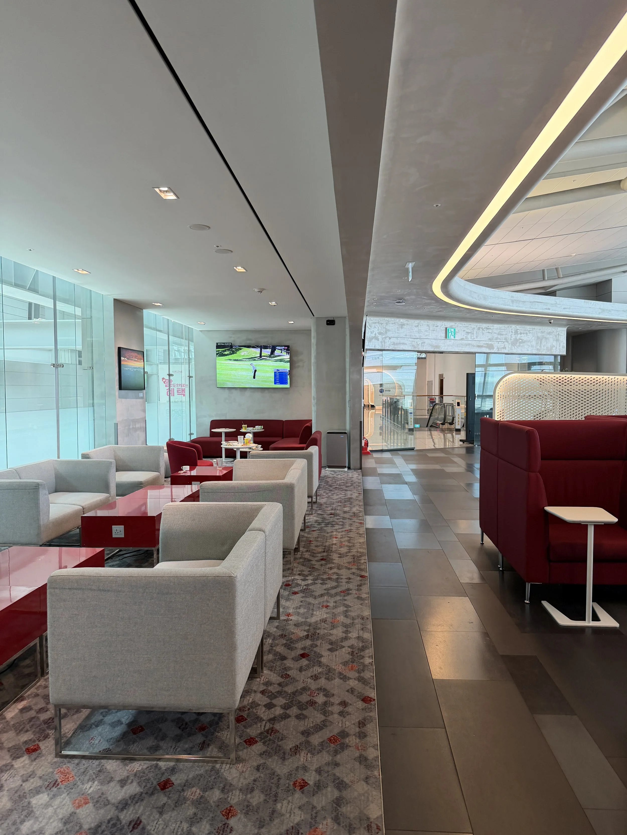 KAL lounge terminal 1 tv looking at entry.JPG