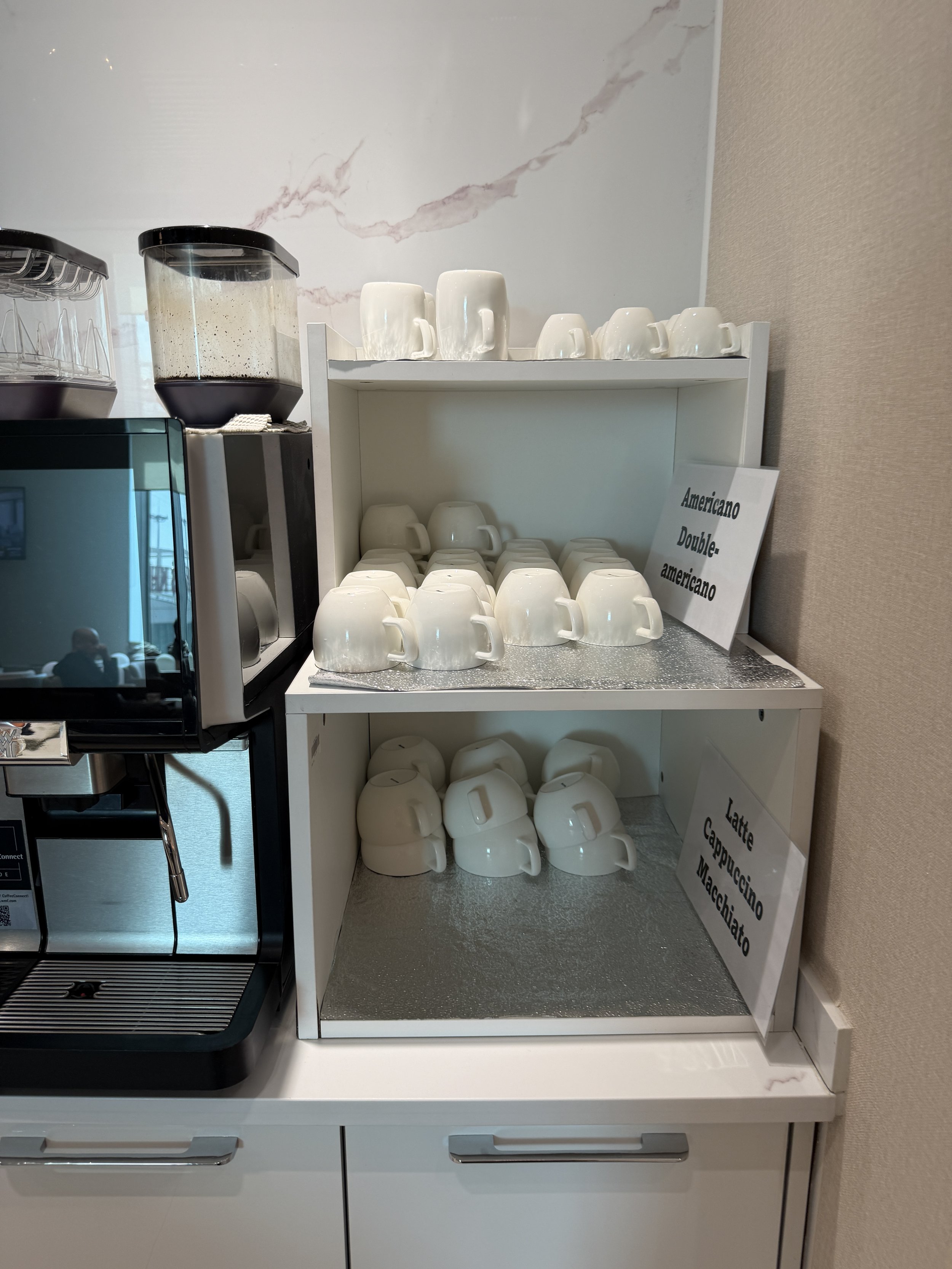 coffee cups at link lounge chinggis khan airport korean air.JPG