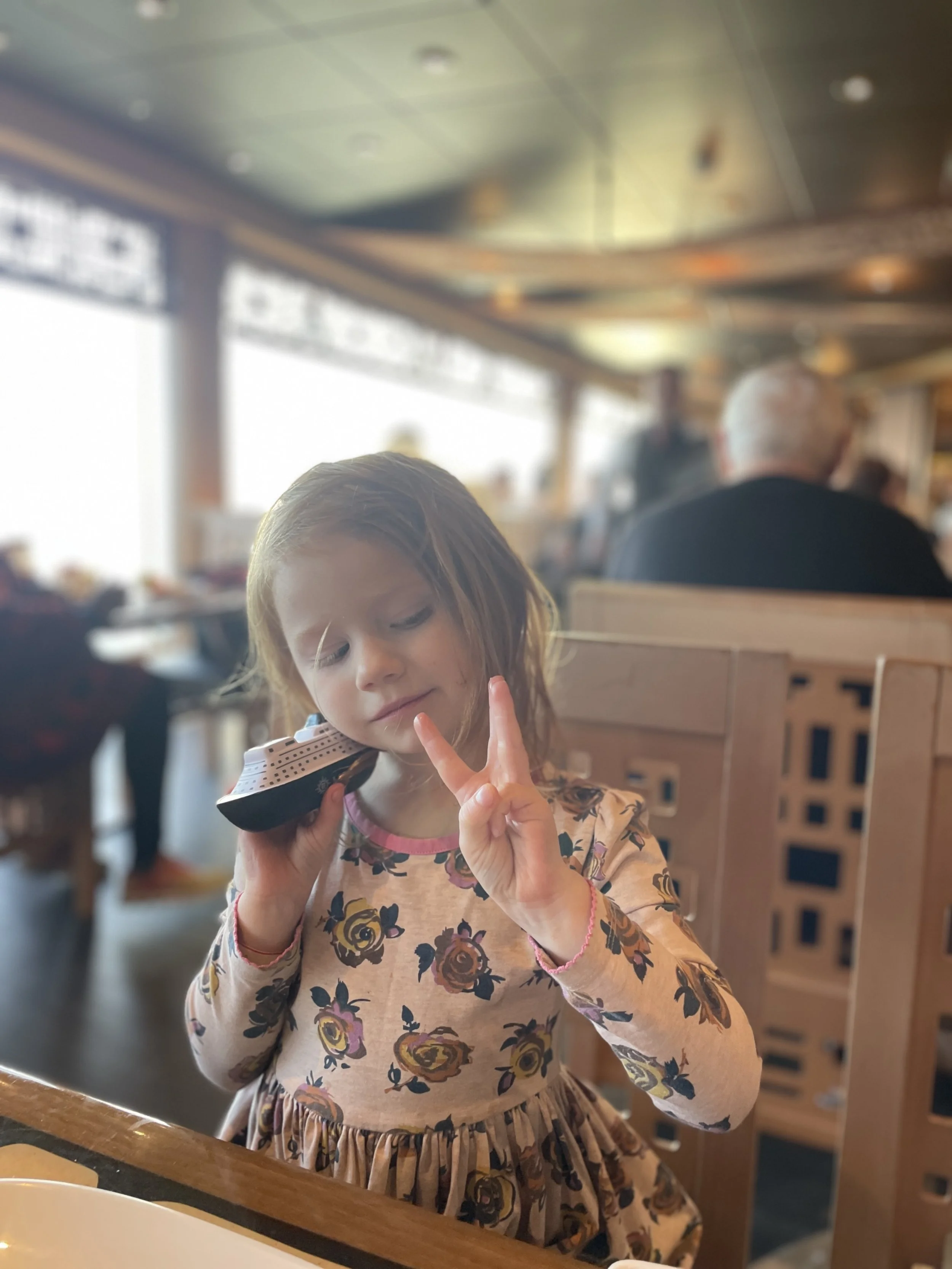 MSC Preziosa Millie with her model ship.jpg