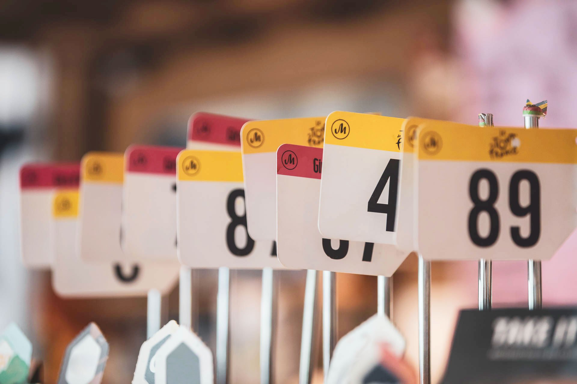 Special table markers were developed in the style of racing numberplates.