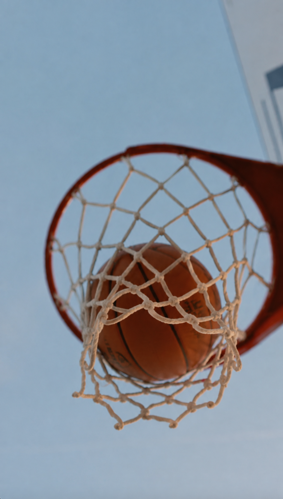 Basketball Swish Against Blue Sky.png