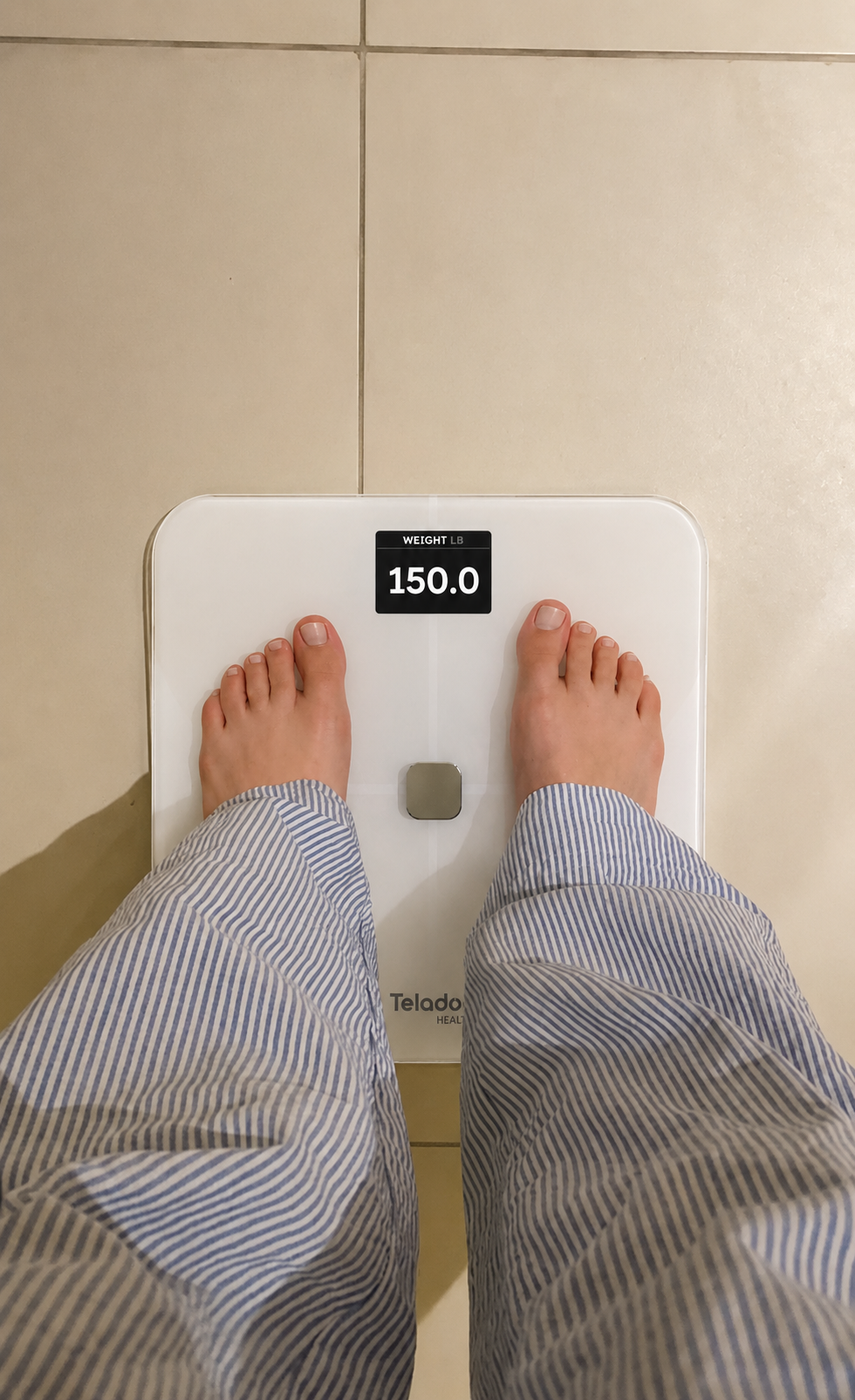 Checking weight on the bathroom scale.png
